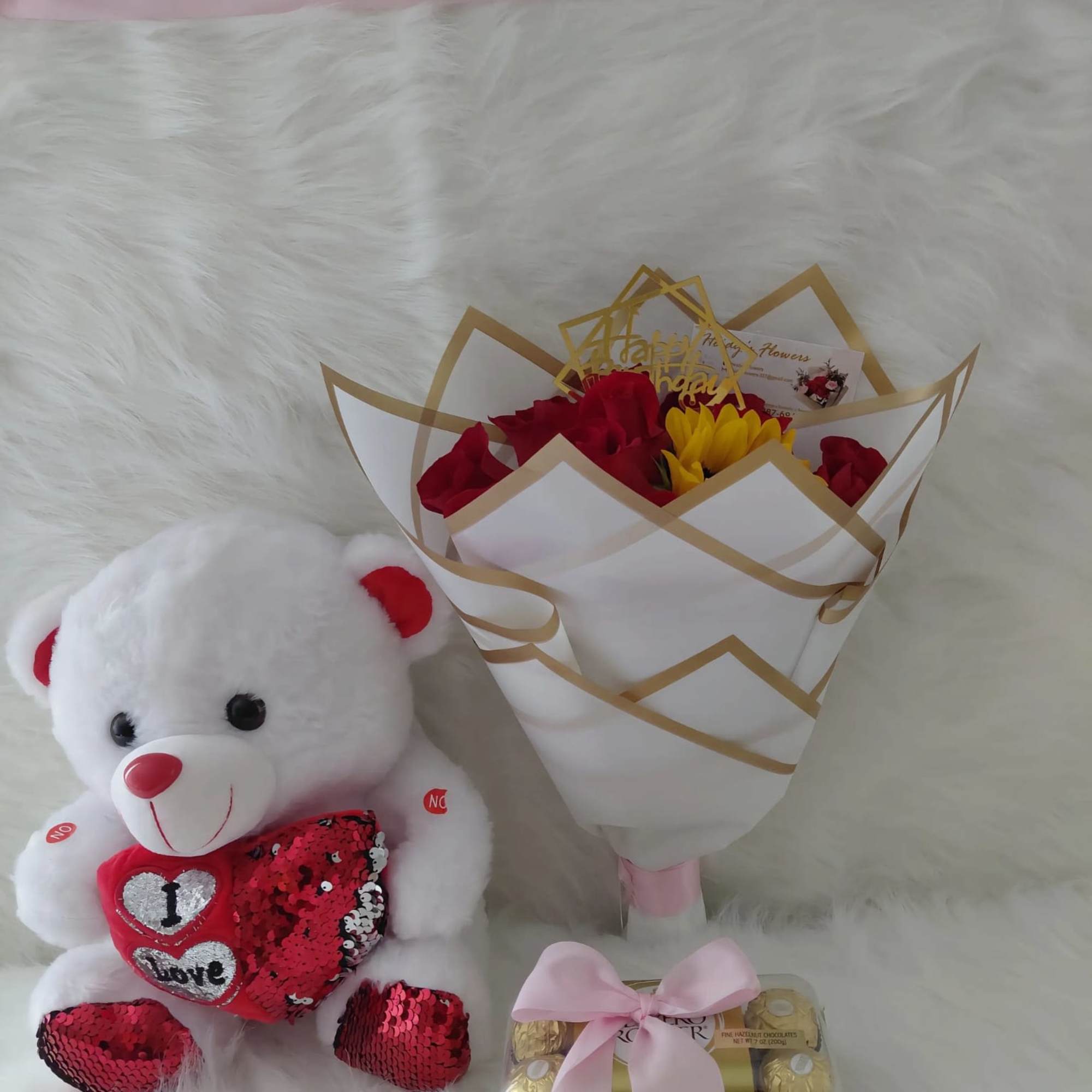 12rosas con girasol un hermoso peluche y chocolates