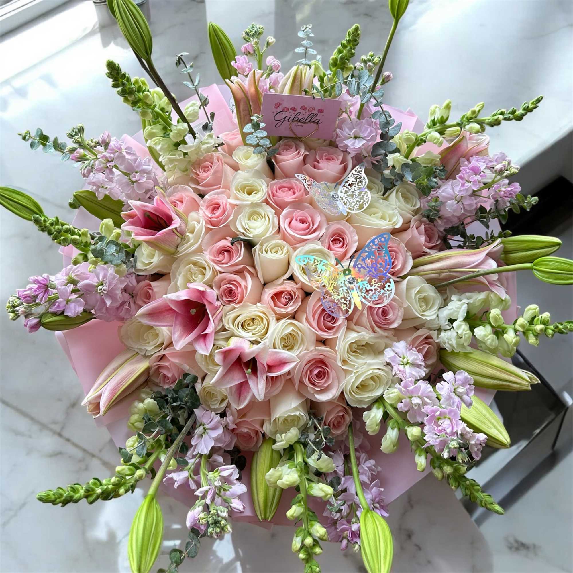 Roses and a garden of flowers lilies, eucalyptus, stock, , whe can