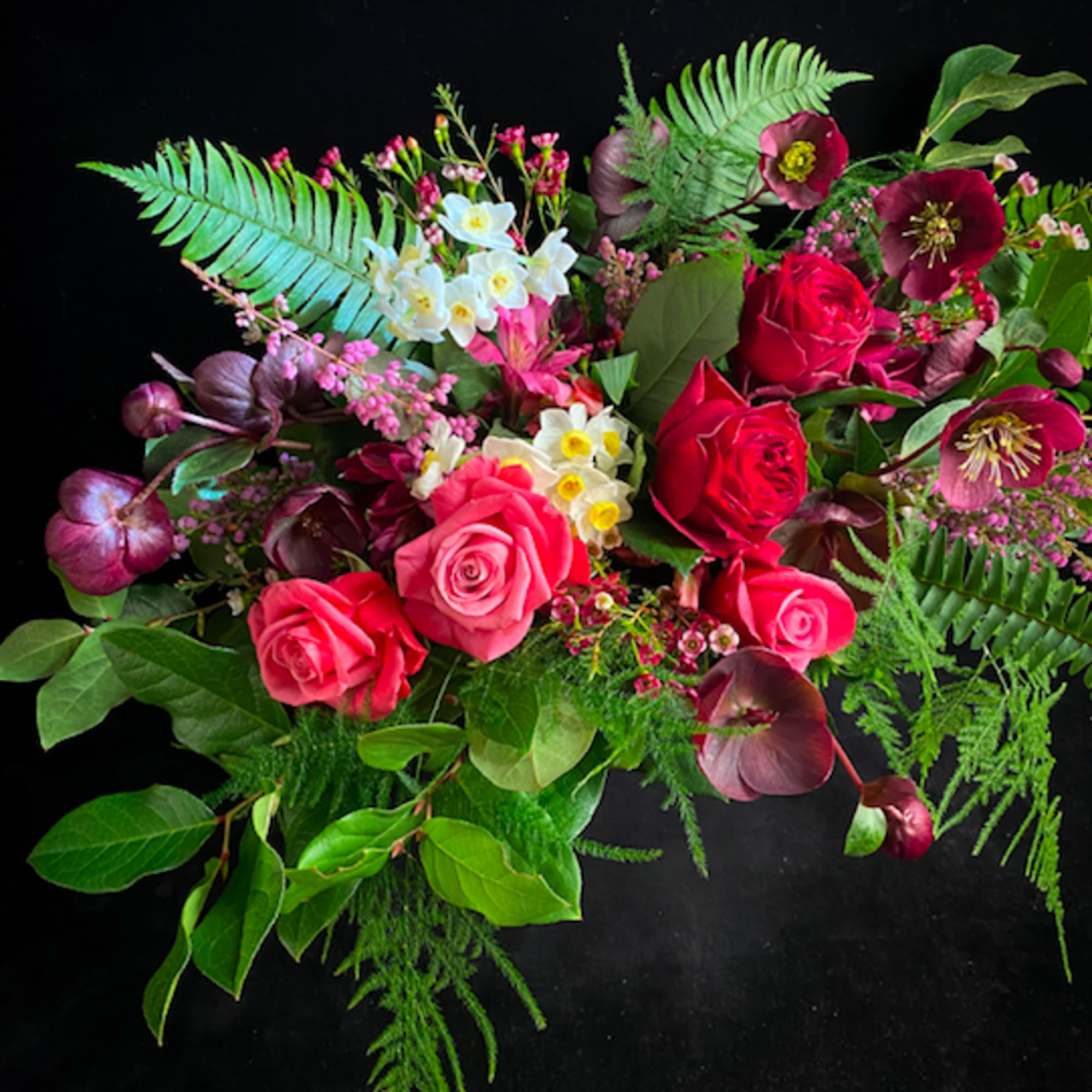 Fern, Hellebore, Heirloom Roses and Narcissus blooms come together to present a