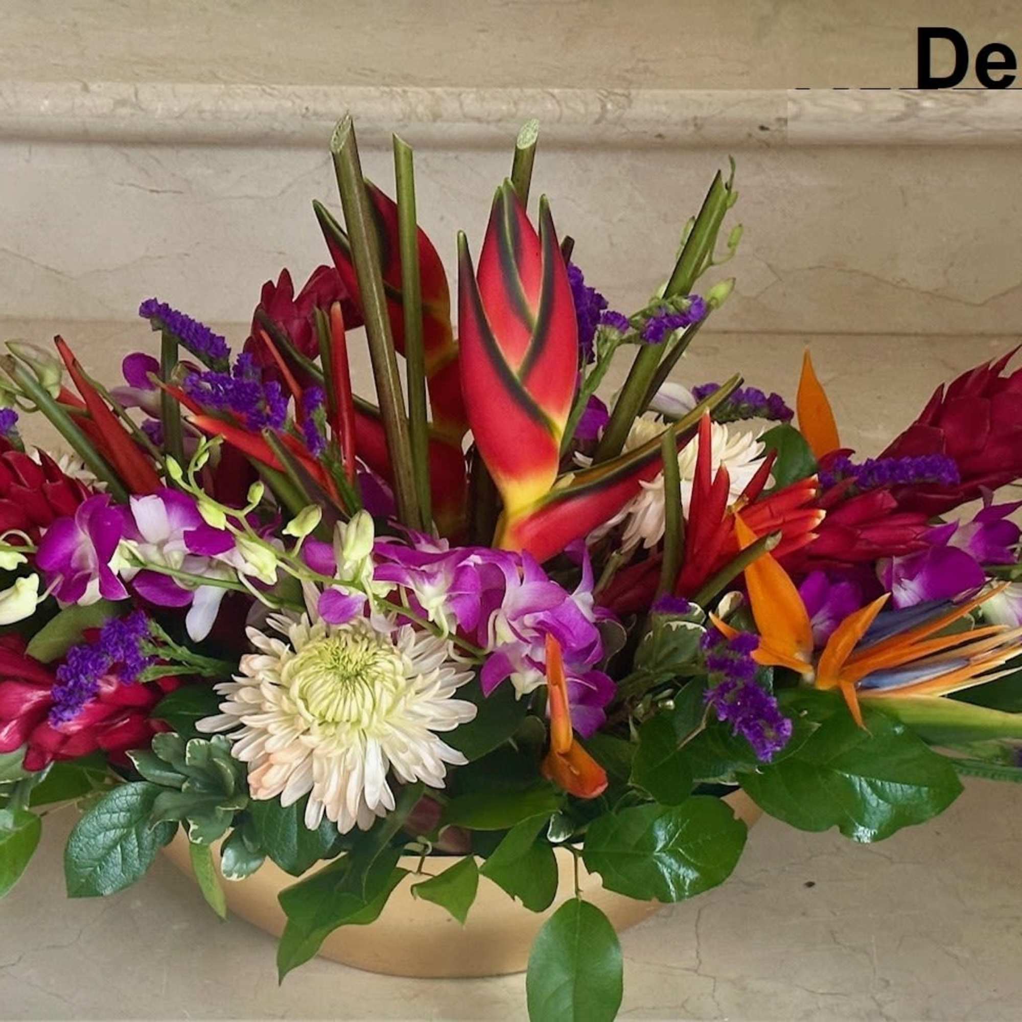 Tropical flowers for a centerpiece arranged low. Ideal for an Event and