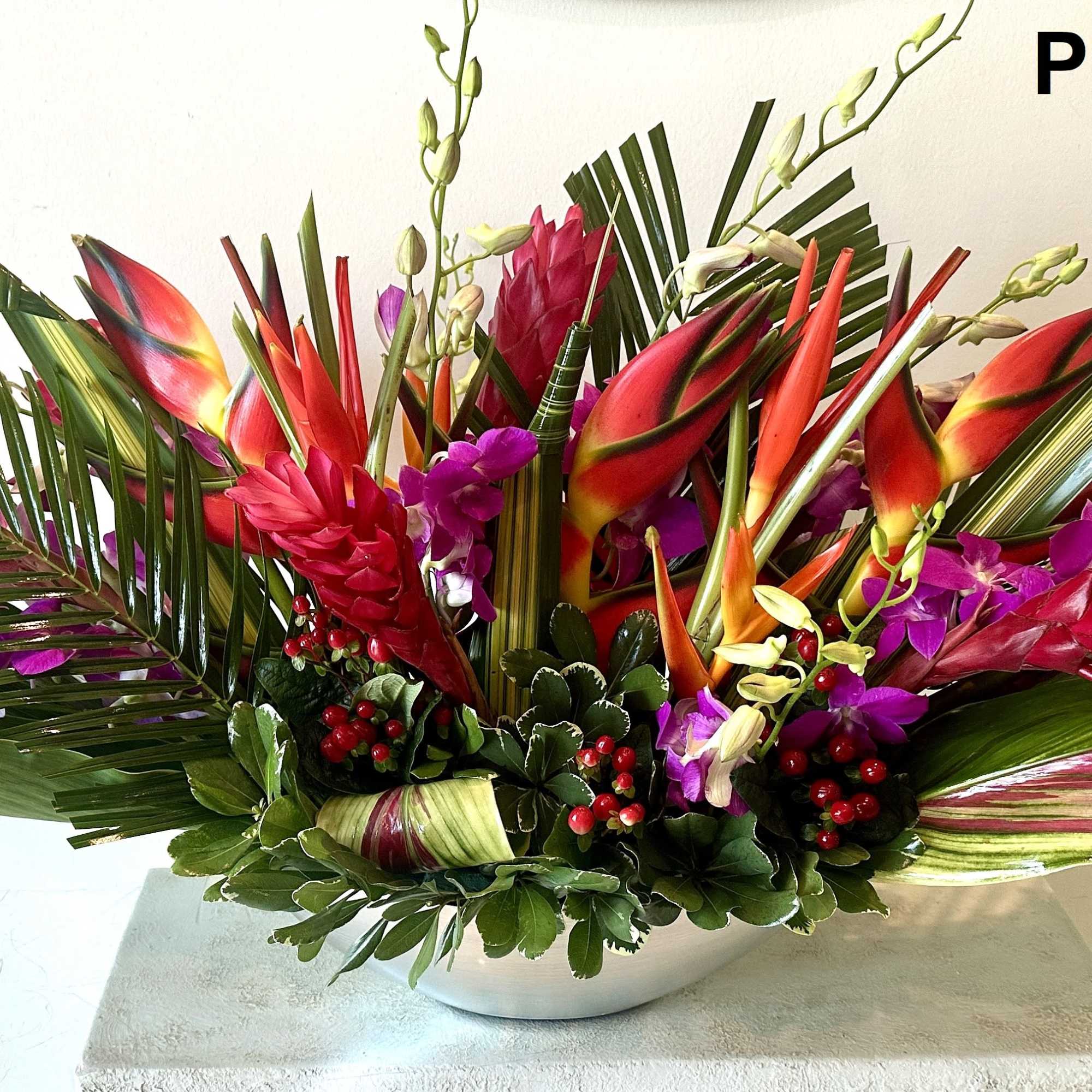 Tropical flowers for a centerpiece arranged low. Ideal for an Event and