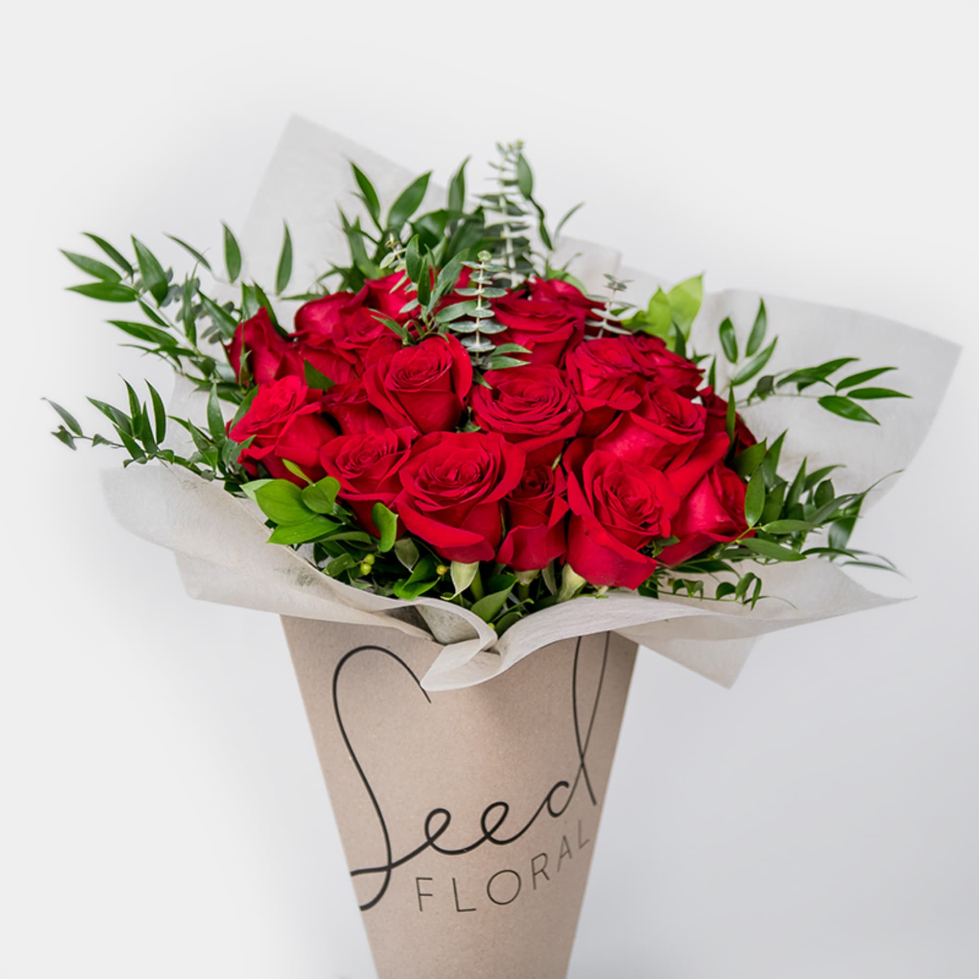 Our 24 Carat bouquet showcases 24 luxurious long-stemmed red roses, hand-tied with