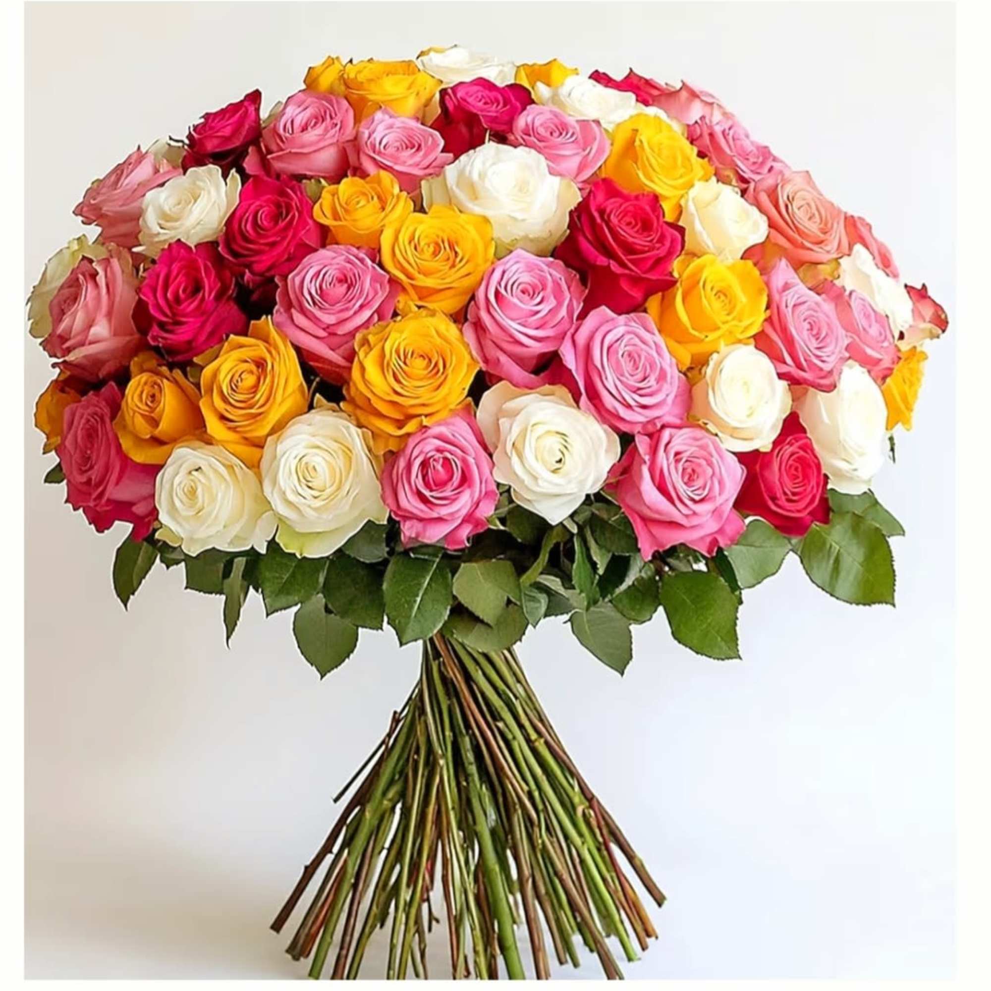 This arrangement features a large, dome-shaped bouquet of roses in a vibrant