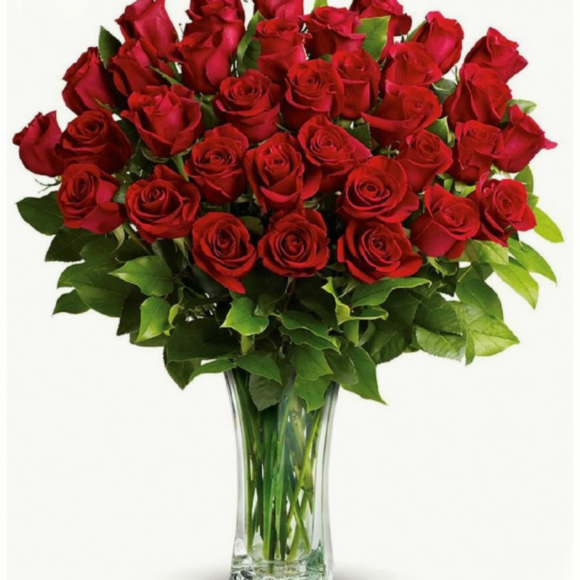 This arrangement features a bouquet of red roses densely packed in a