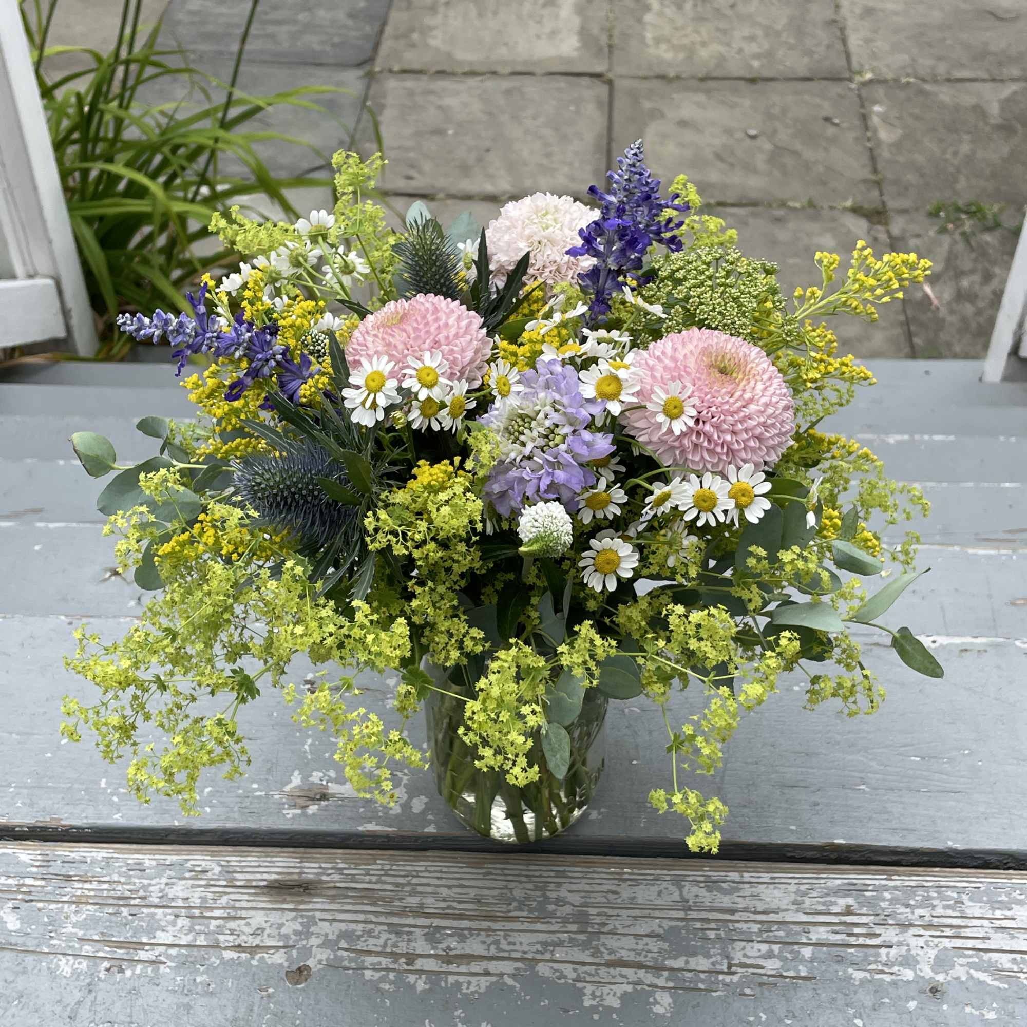This arrangement features a more wild, picked from the garden vibe with