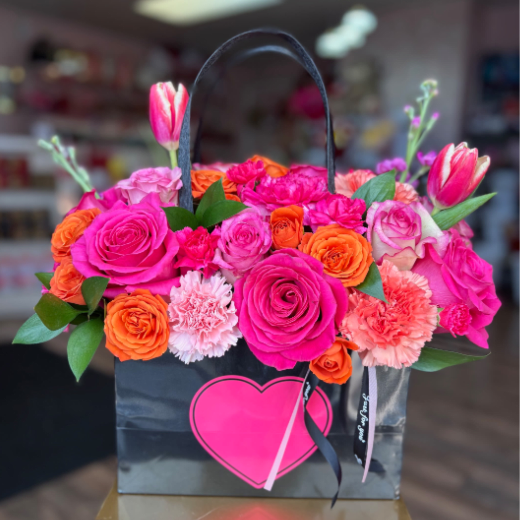  Our best-selling Tote bouquet is gathered with a mix of Vibrant