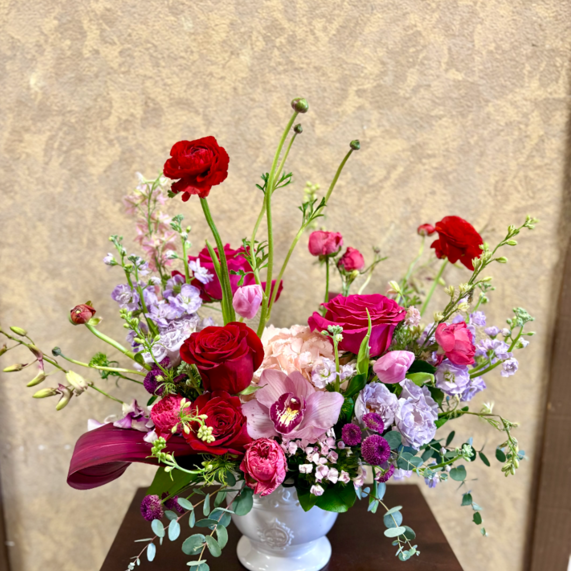 Recipe: This wild, garden look has seasonal ranuculus, pink roses, hydrangae, tulips