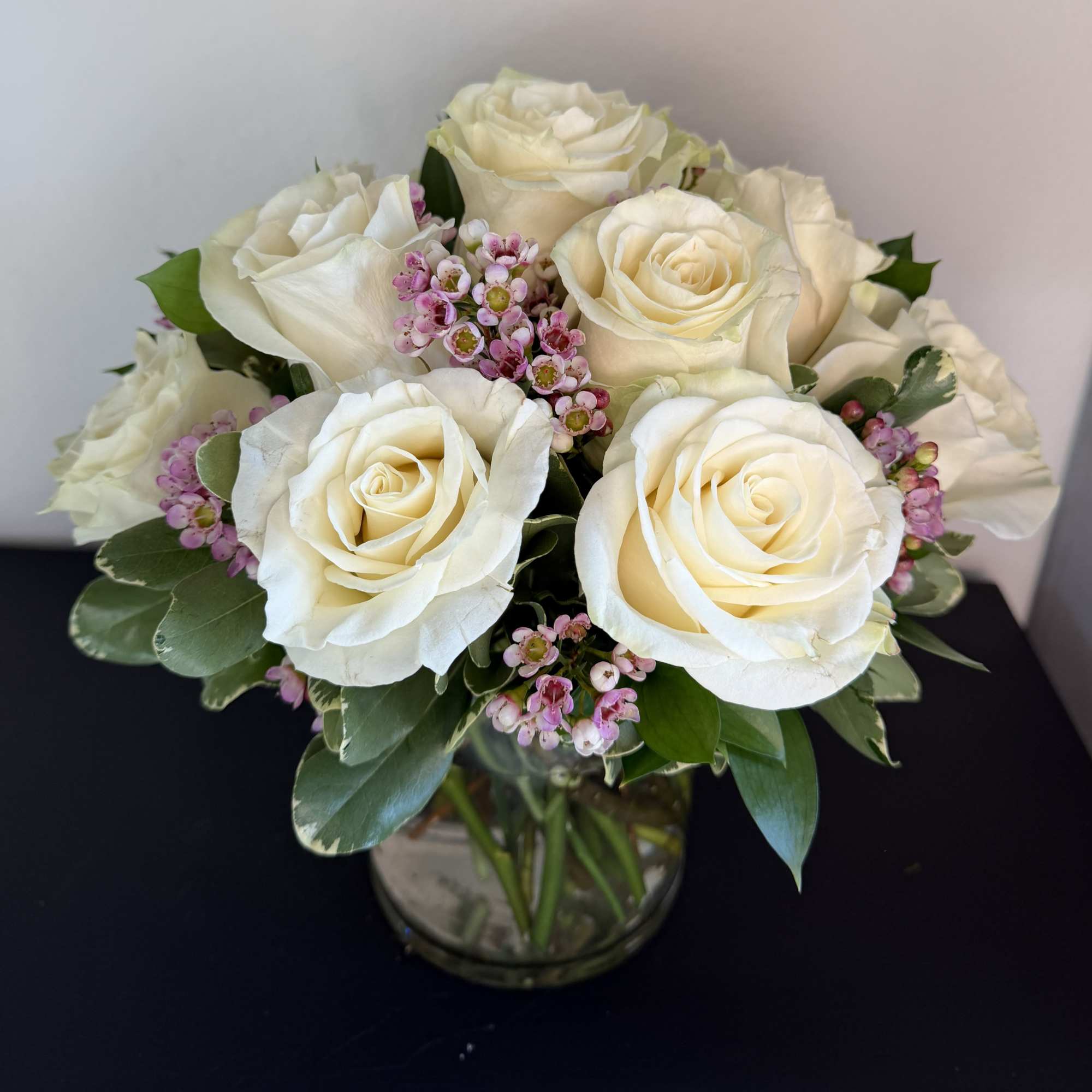 12 premium white roses in a low and lush style