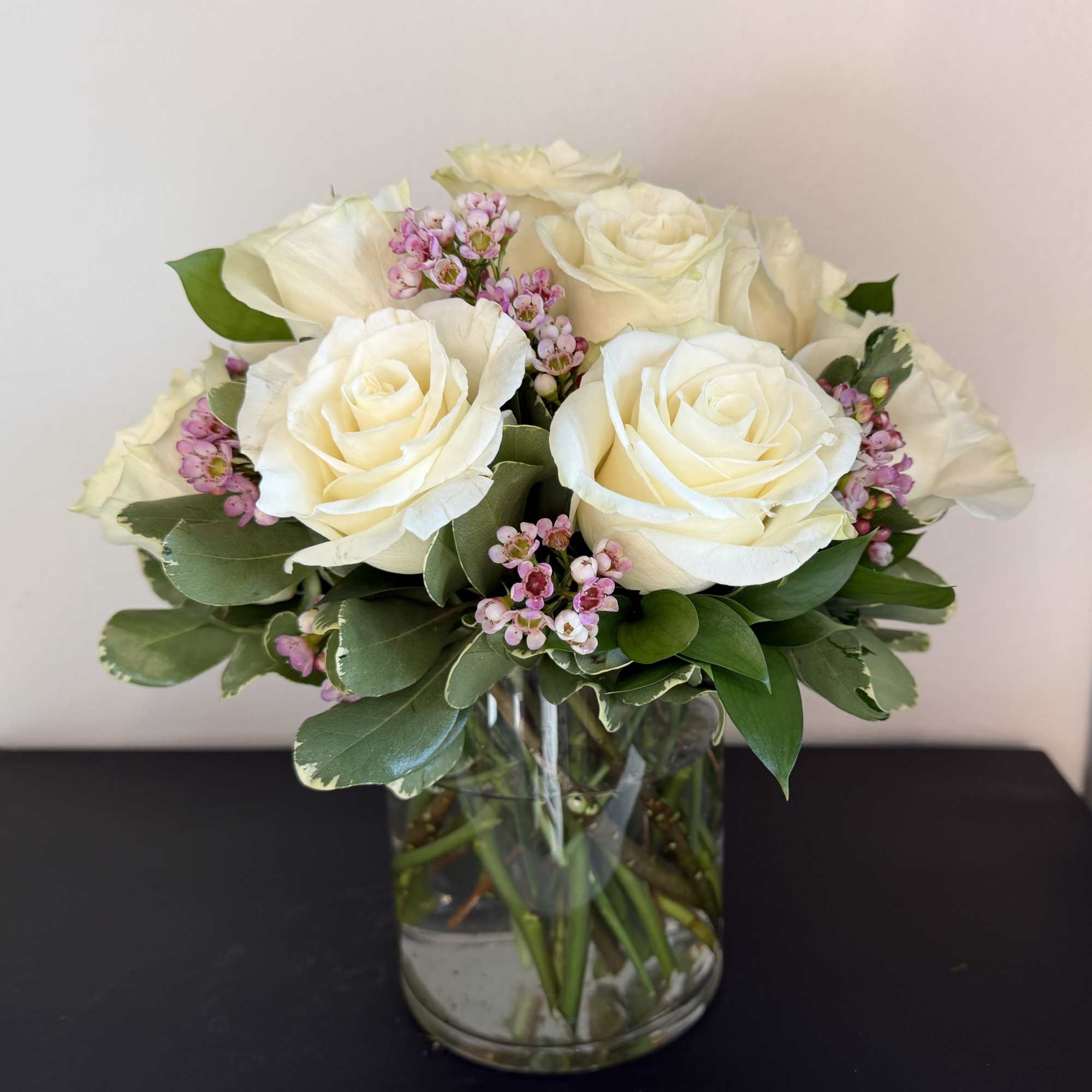 12 premium white roses in a low and lush style