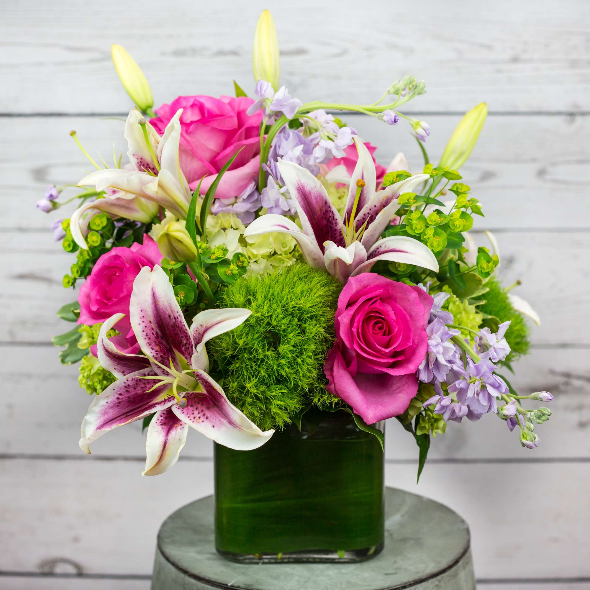 Pink Roses, Green Hydrangea, Spider Mum, Lily, Stock. Flowers and containers availability