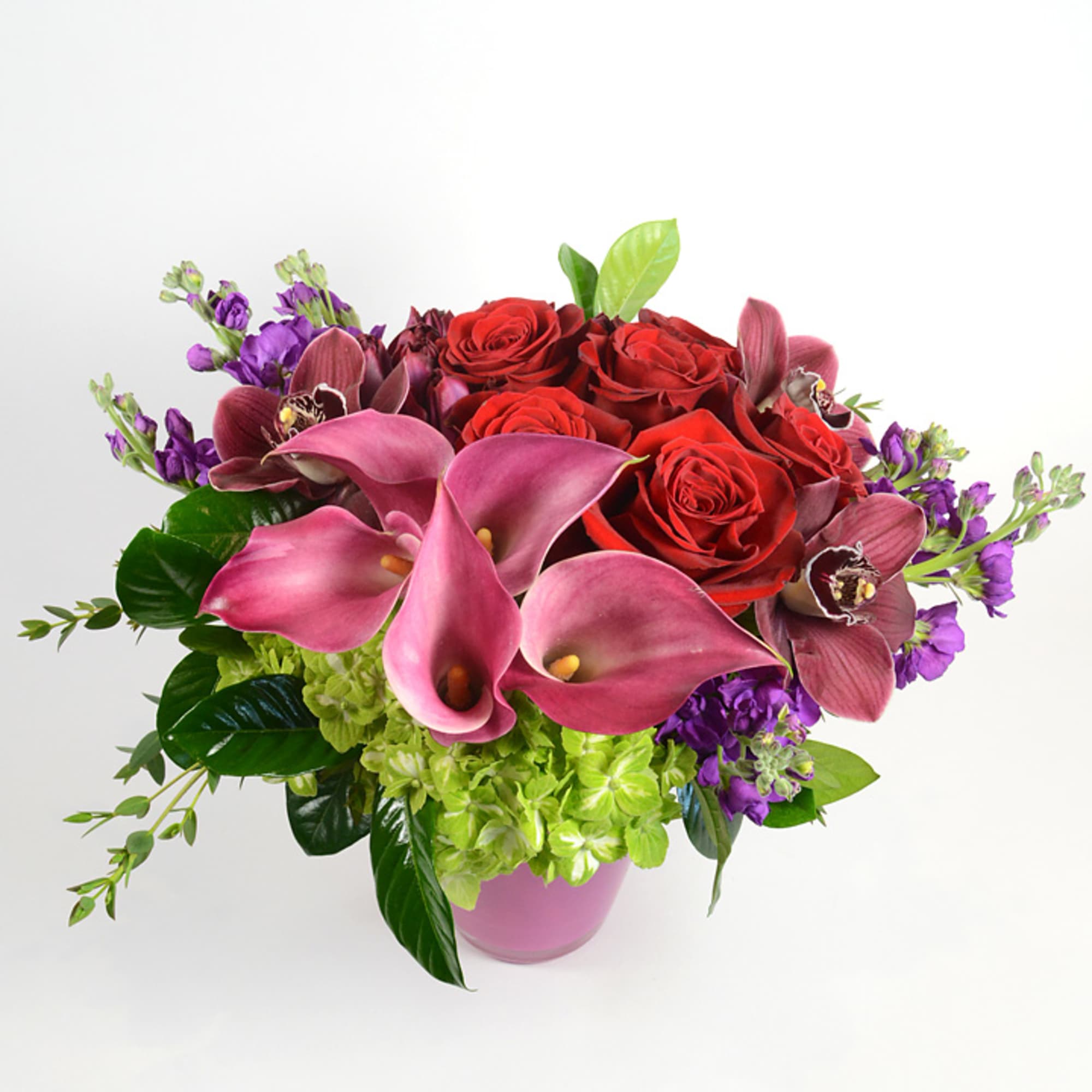 Our stunning Captain Romance arrangement is created with a dozen red roses