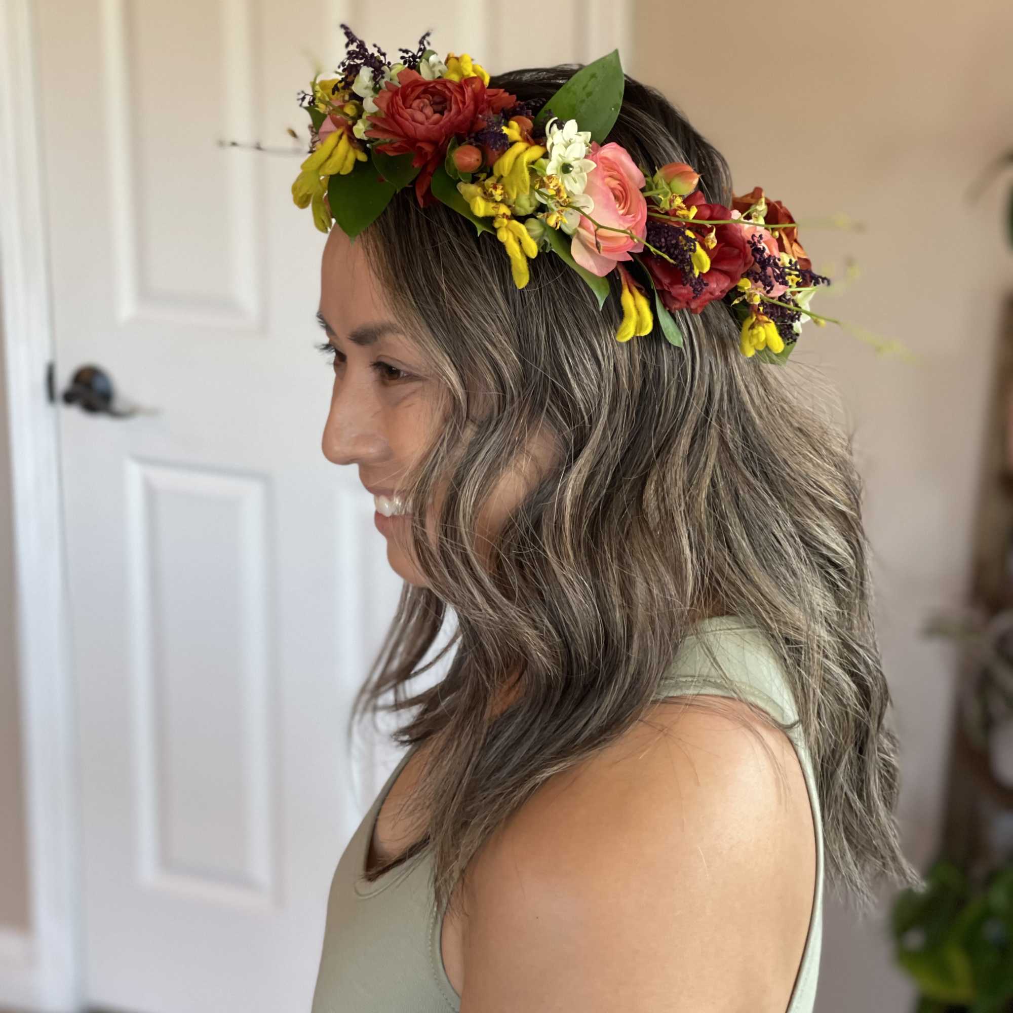 A handcrafted halo of fresh blooms, designed to be worn for weddings