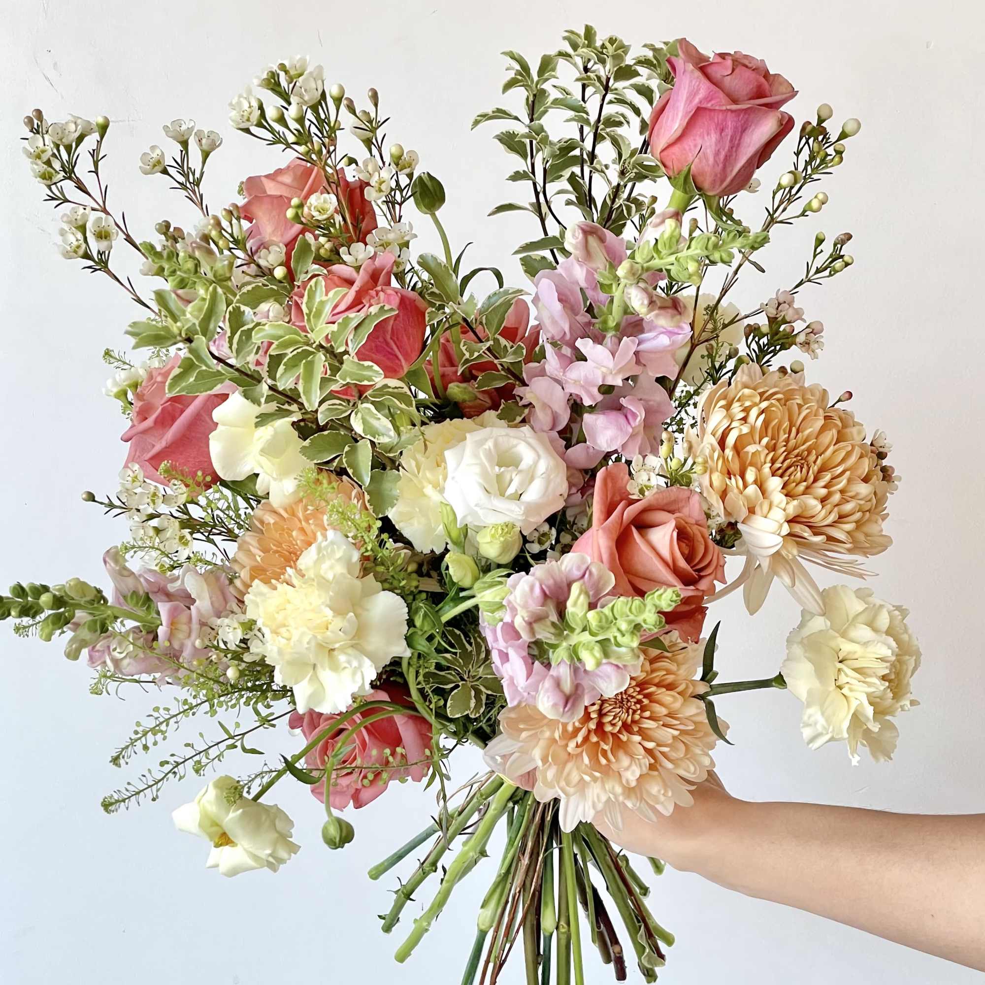 Experience a one of a kind floral arrangement, thoughtfully designed by our