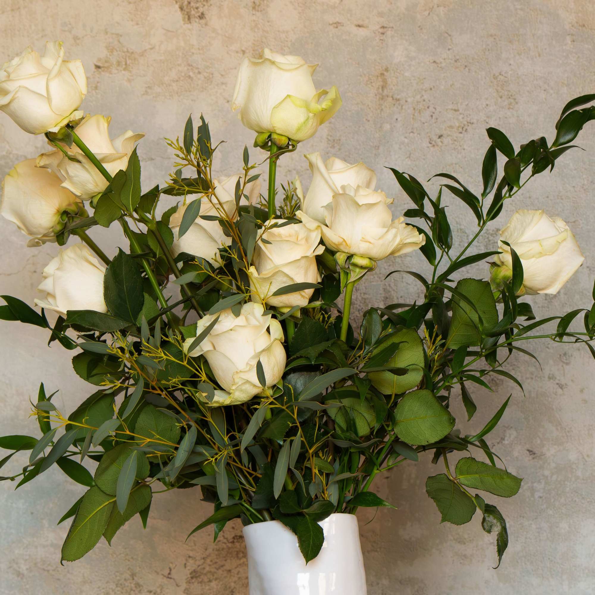 Celebrate love, beauty, and connection with a stunning arrangement of a dozen