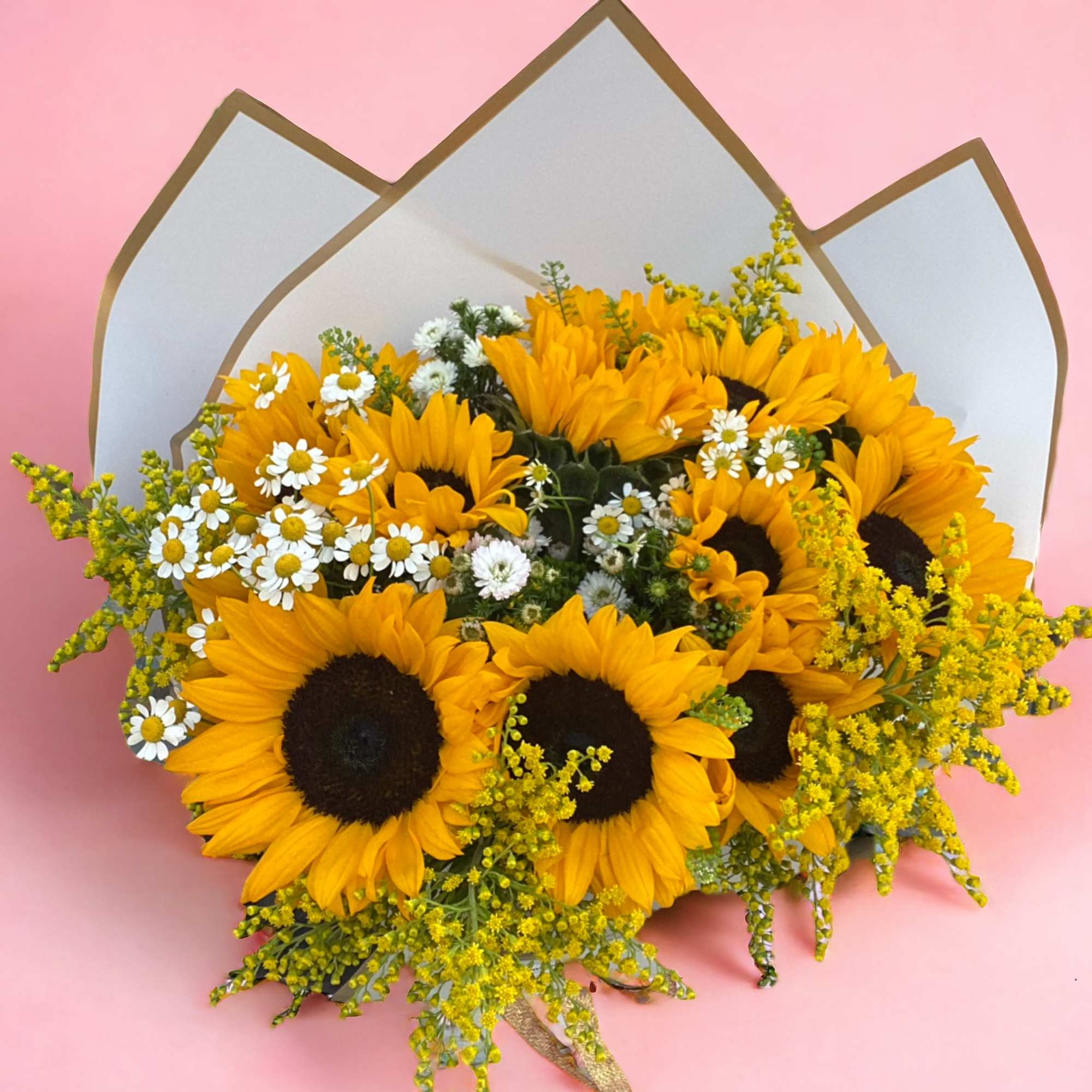 A bouquet of 8 long stem sunflowers and other flowers for any