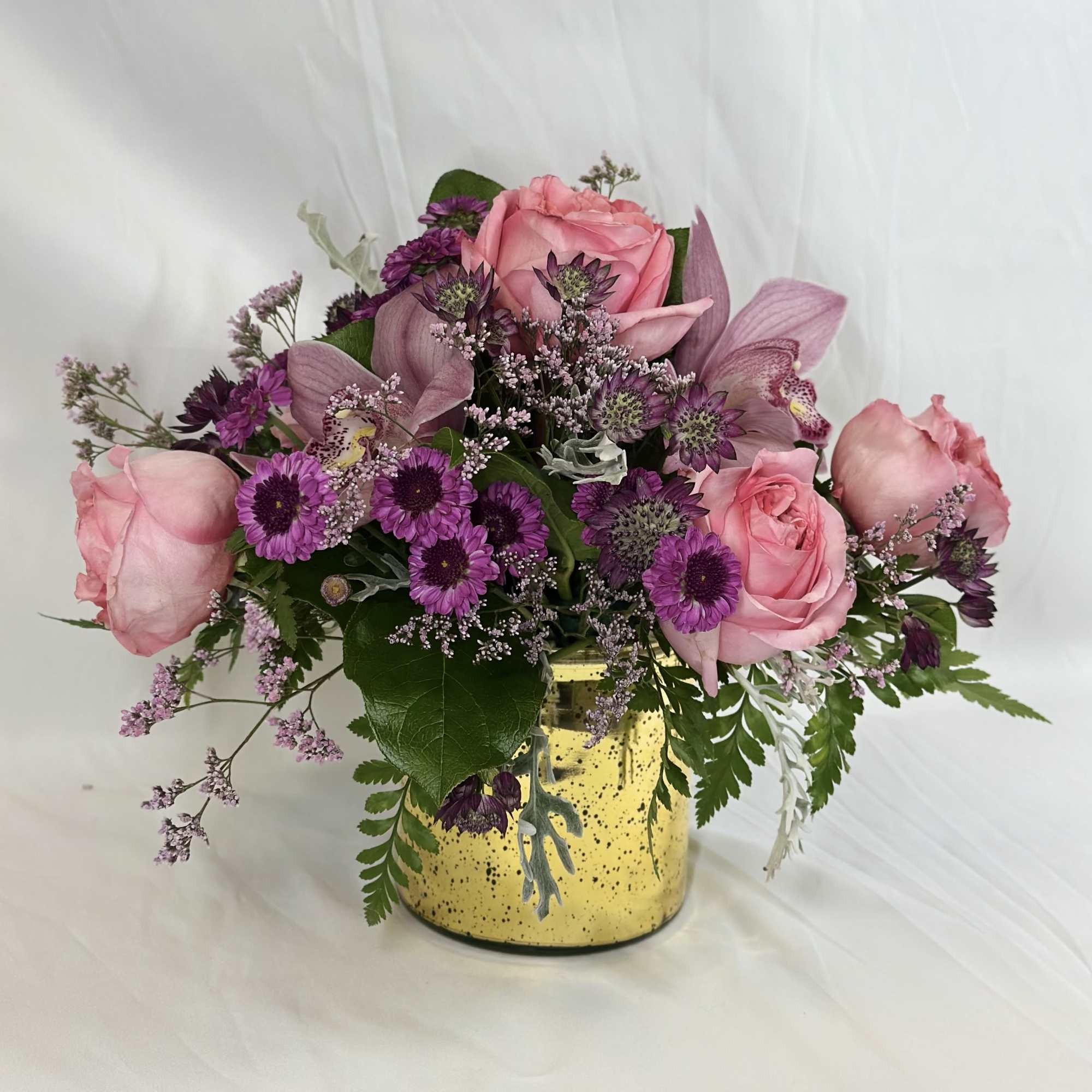 Go all out with this upscale arrangement showcasing elegant orchid blossoms and