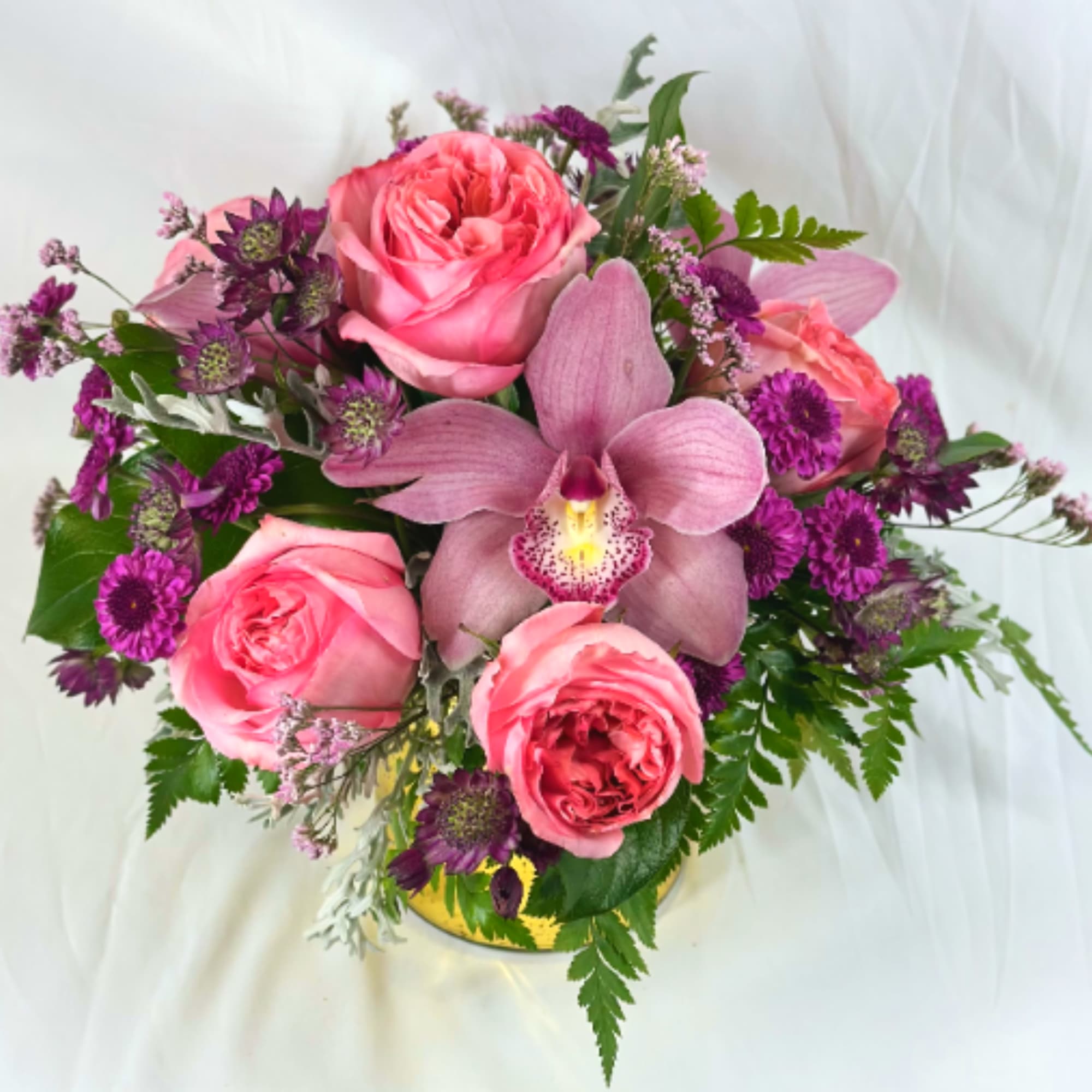 Go all out with this upscale arrangement showcasing elegant orchid blossoms and