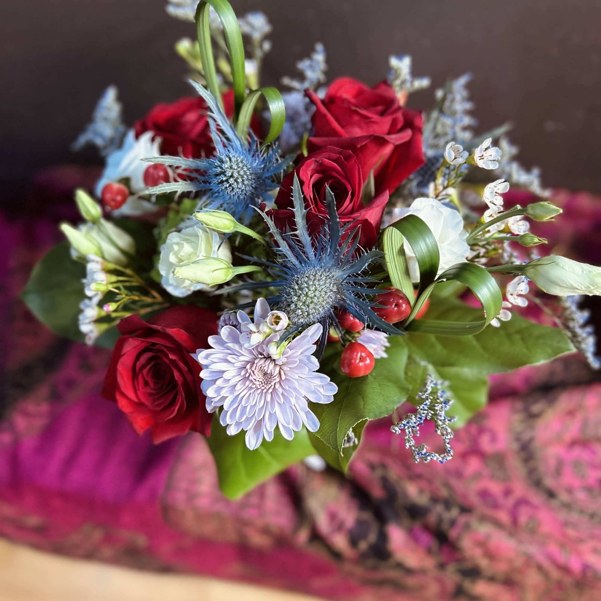 Valentine&rsquo;s Day Special arrangement, featuring orchids and half a dozen red roses