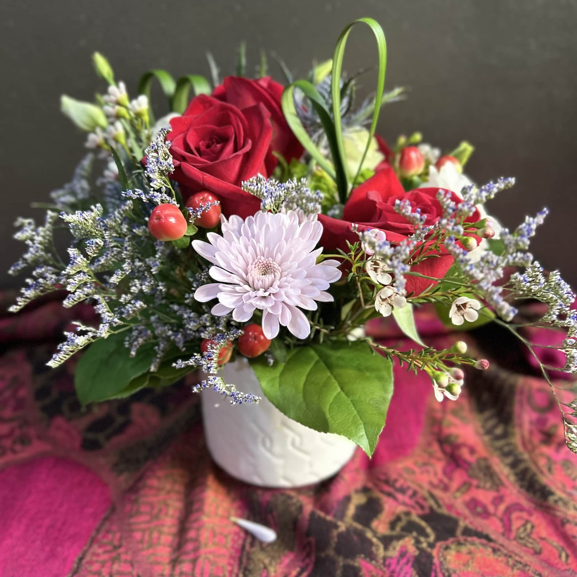 Valentine&rsquo;s Day Special arrangement, featuring orchids and half a dozen red roses