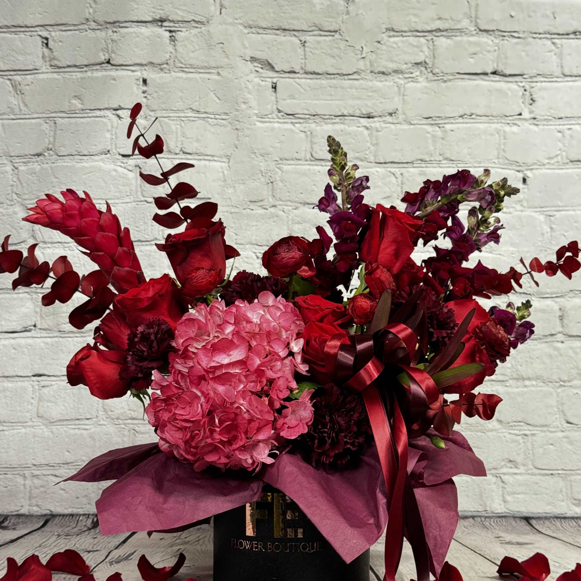 Indulge in a world of enchantment with our "Dark Romance" floral arrangement