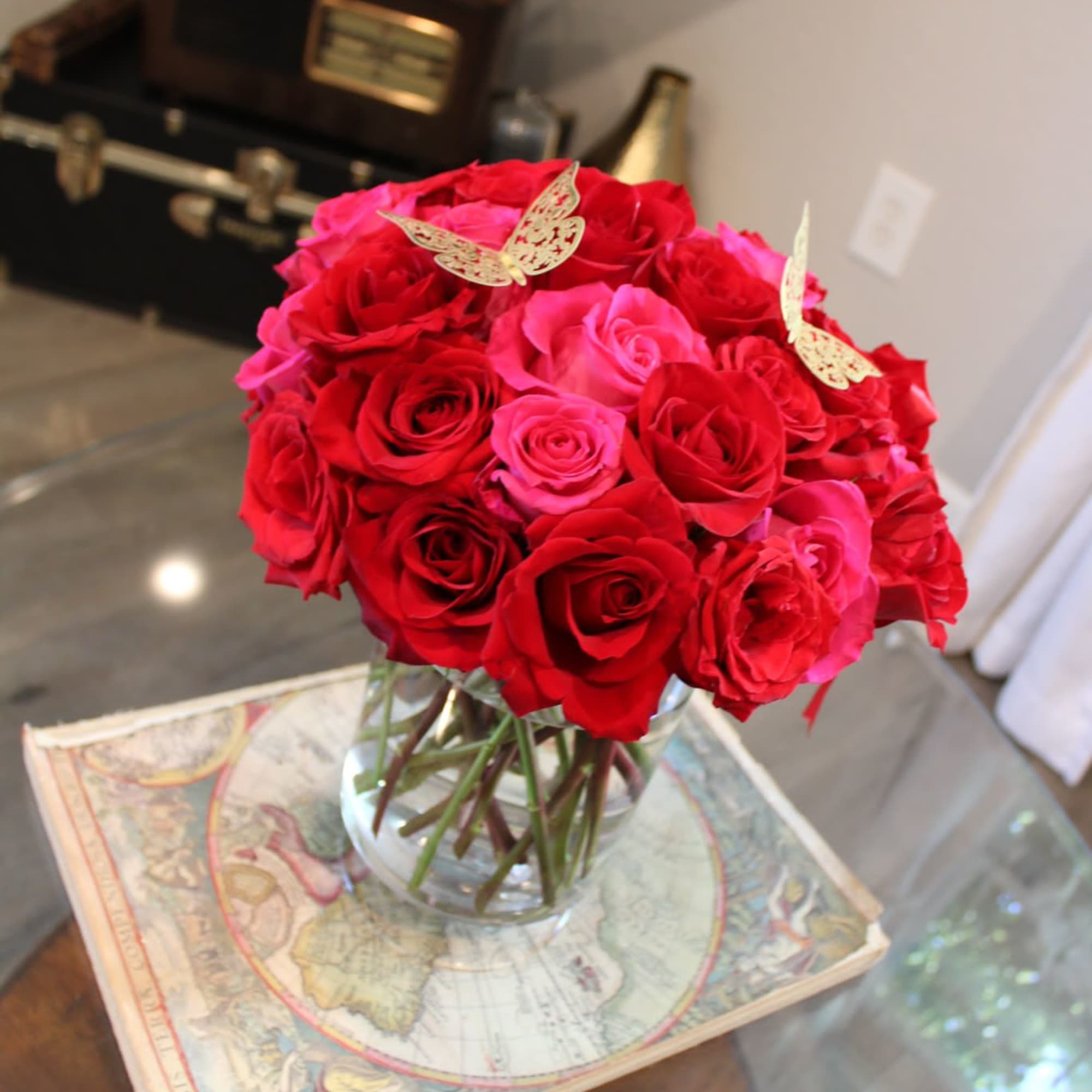 36 hight quality roses , any color in a glass vase 