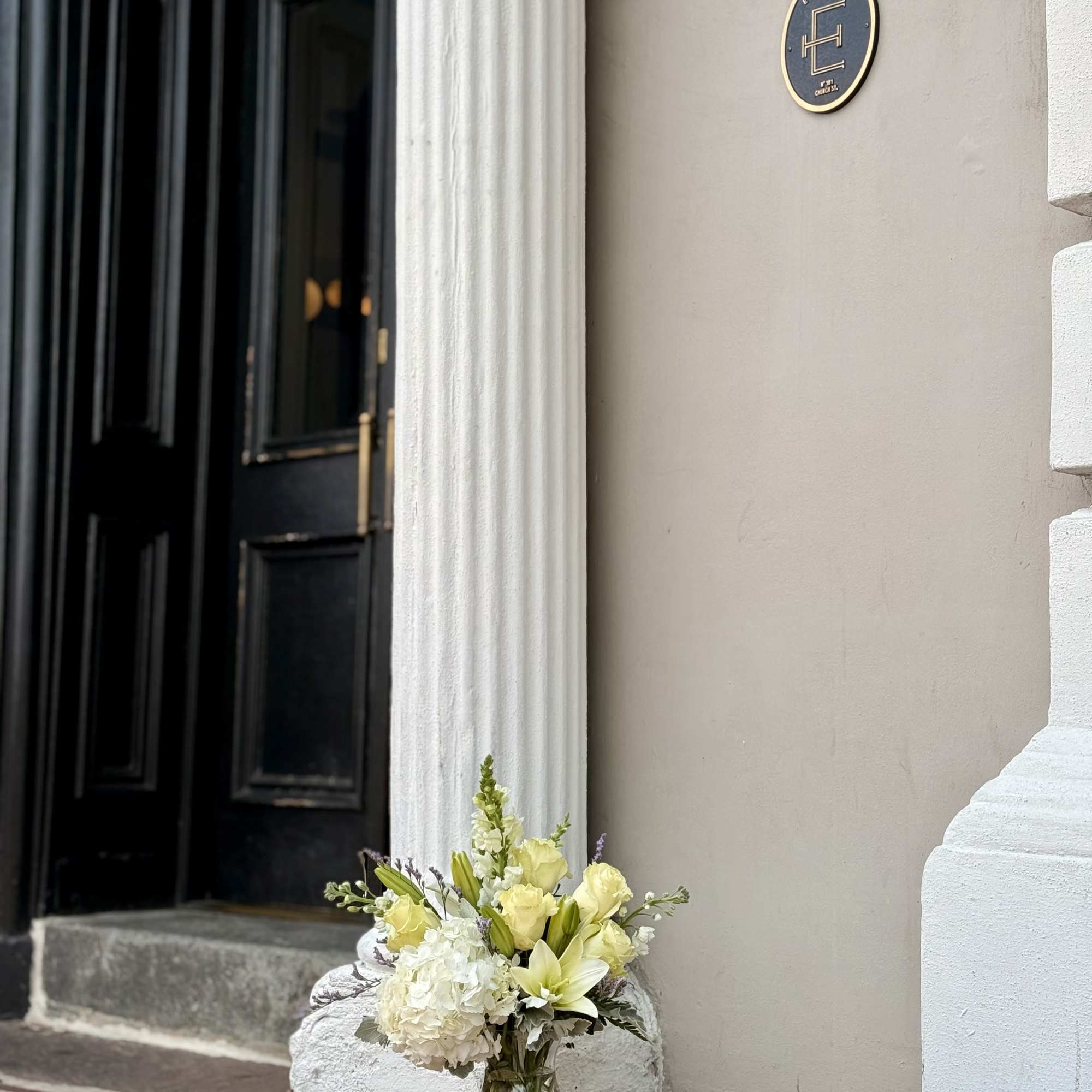 The Pure White floral arrangement features a timeless blend of fresh flowers