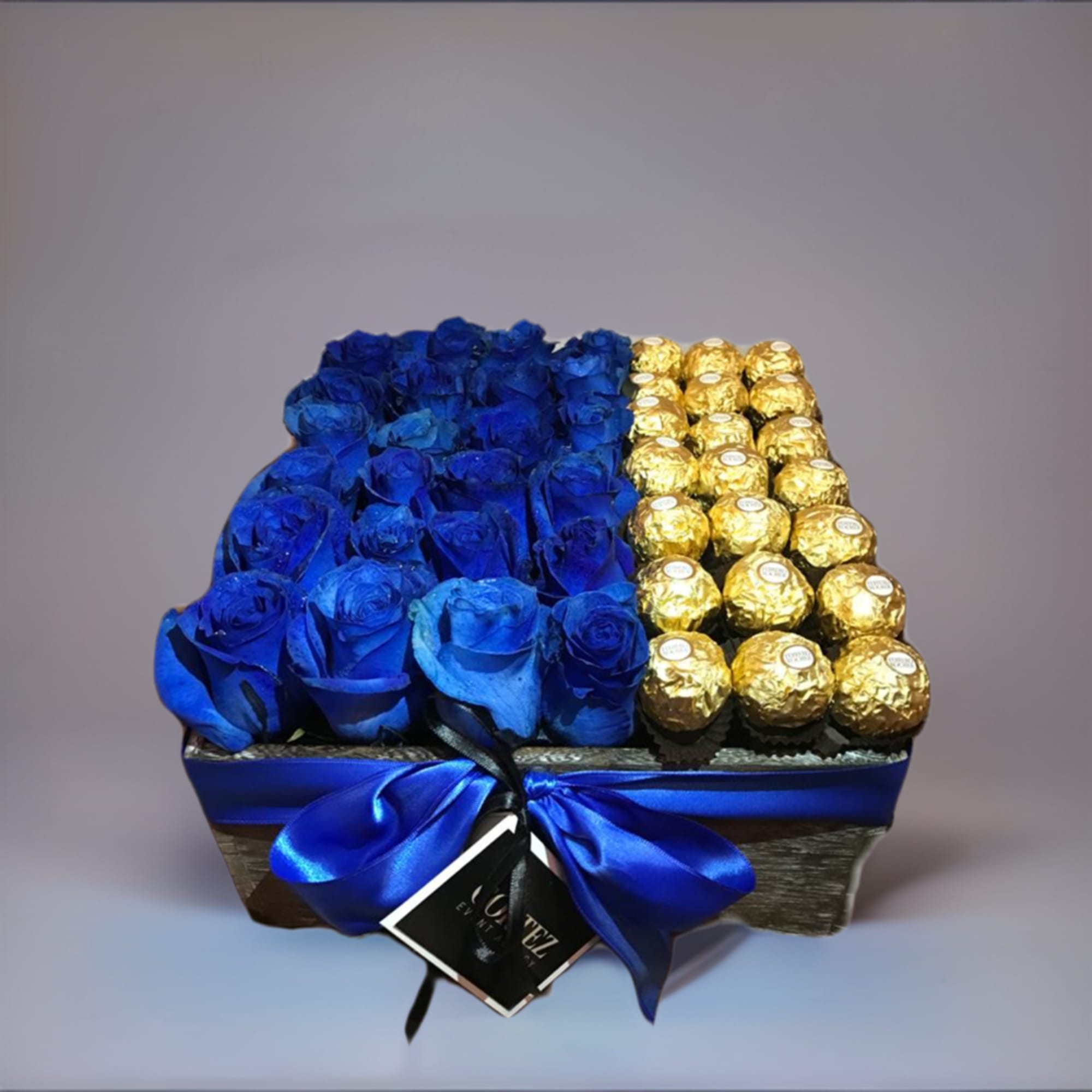 Delightful box featuring stunning blue roses paired with luxurious Ferrero Rocher chocolates.