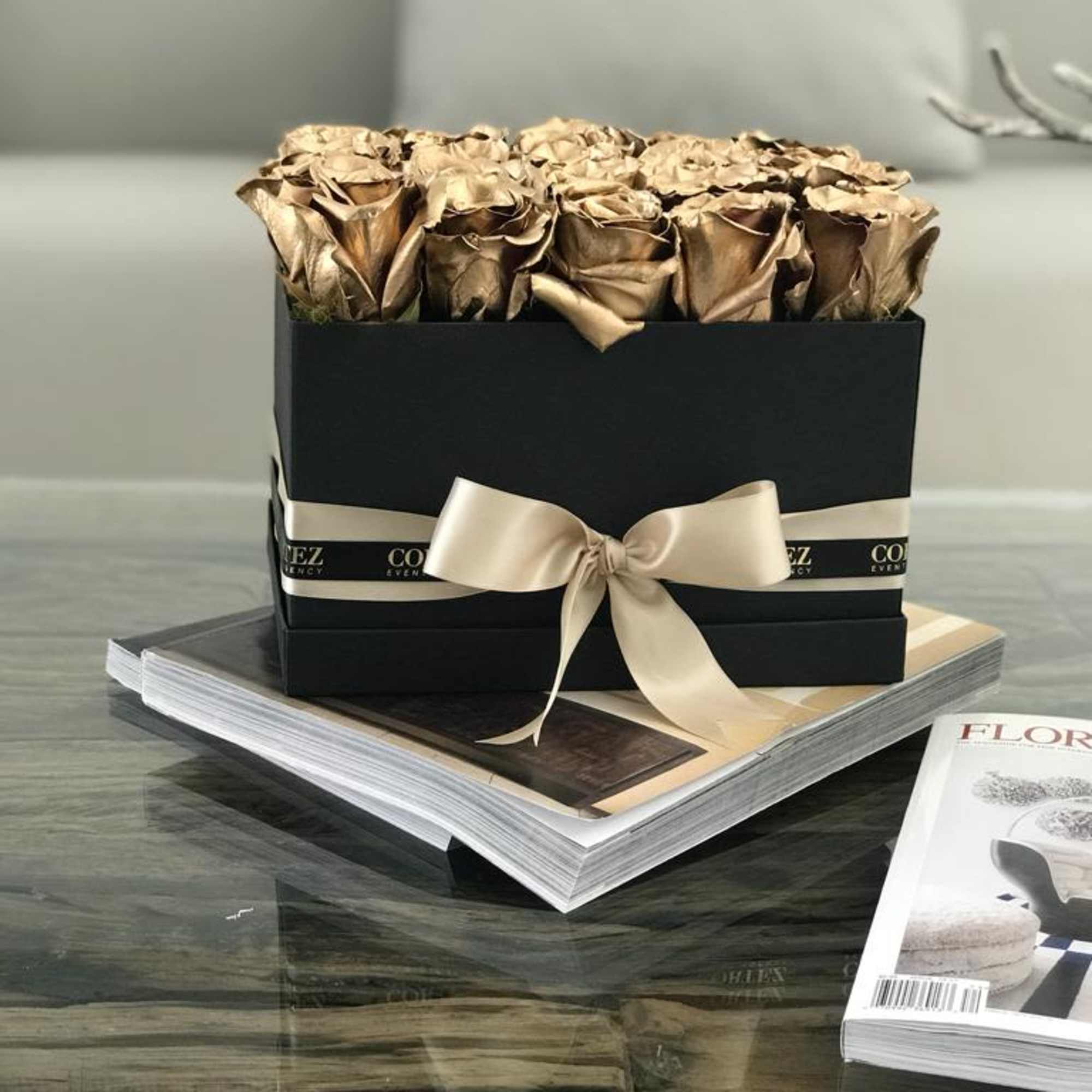 Elegant box filled with approximately 20 gold roses, offering a luxurious and
