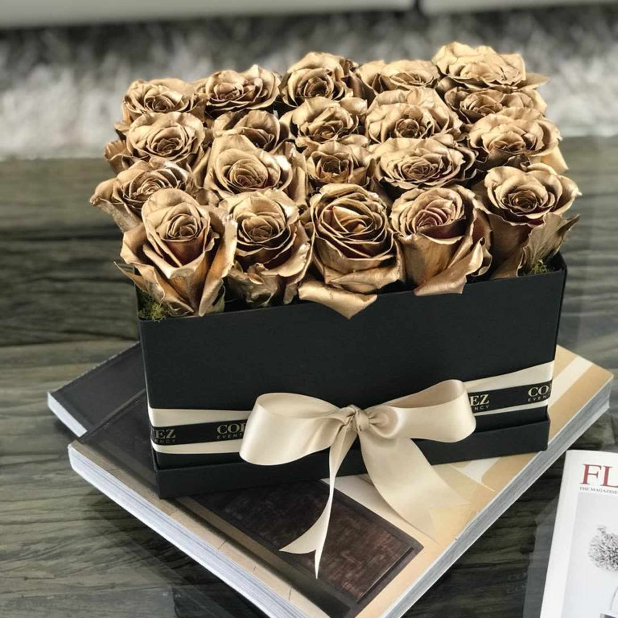 Elegant box filled with approximately 20 gold roses, offering a luxurious and