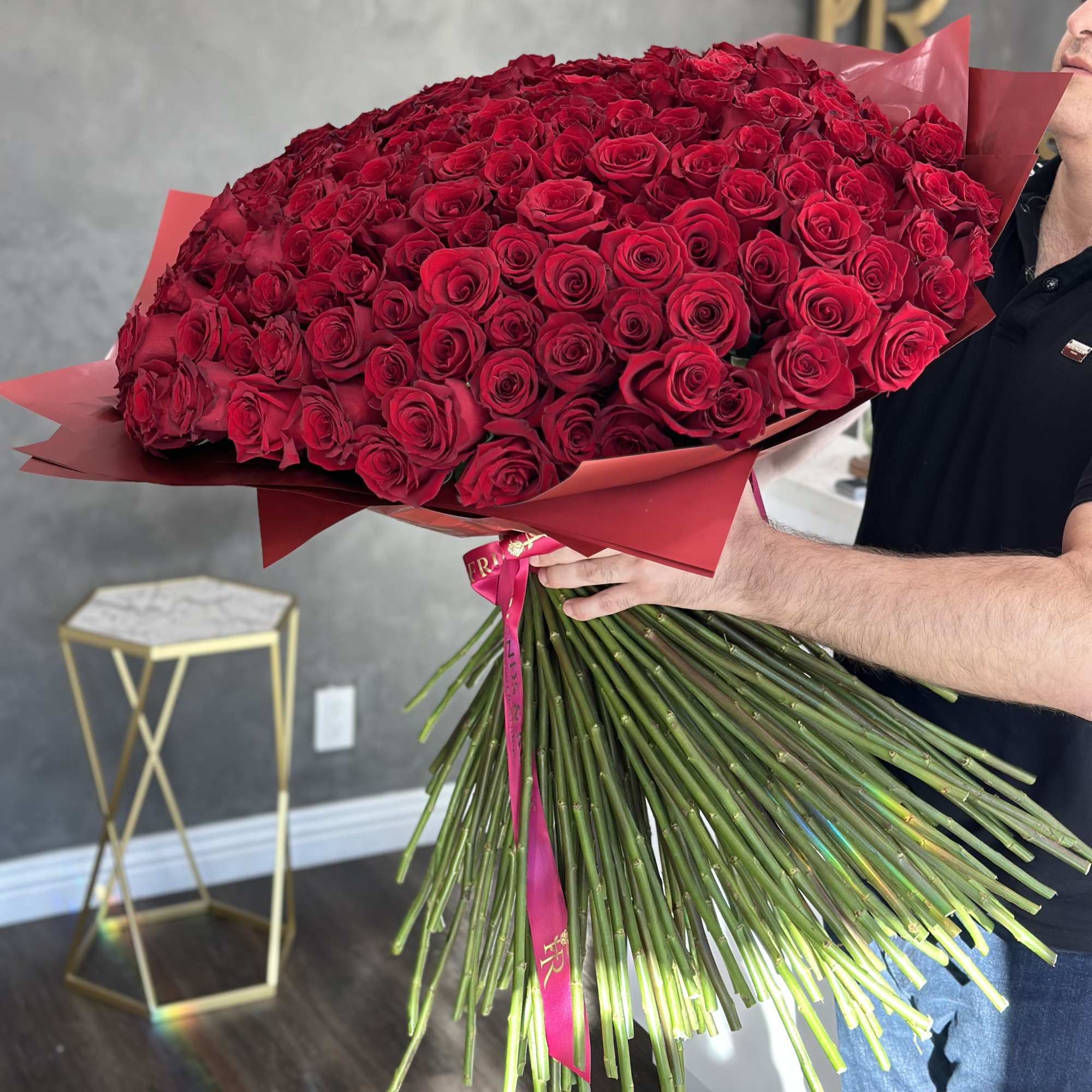 A gorgeous floral arrangement of 250 fresh-cut red roses is a unique