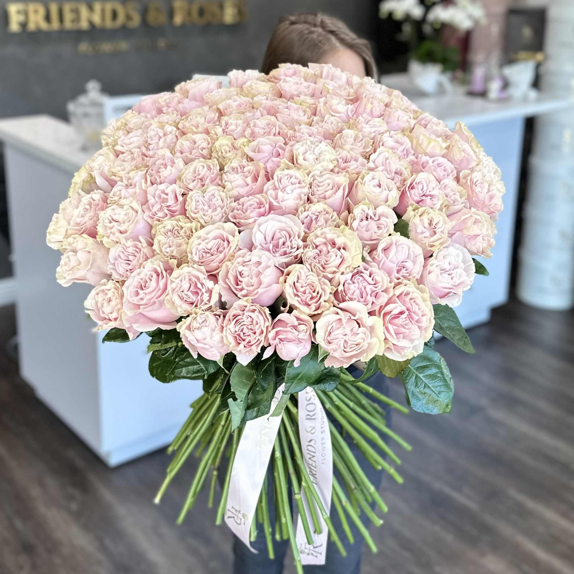 A gorgeous handcrafted bouquet of 100  pink  heart shaped roses