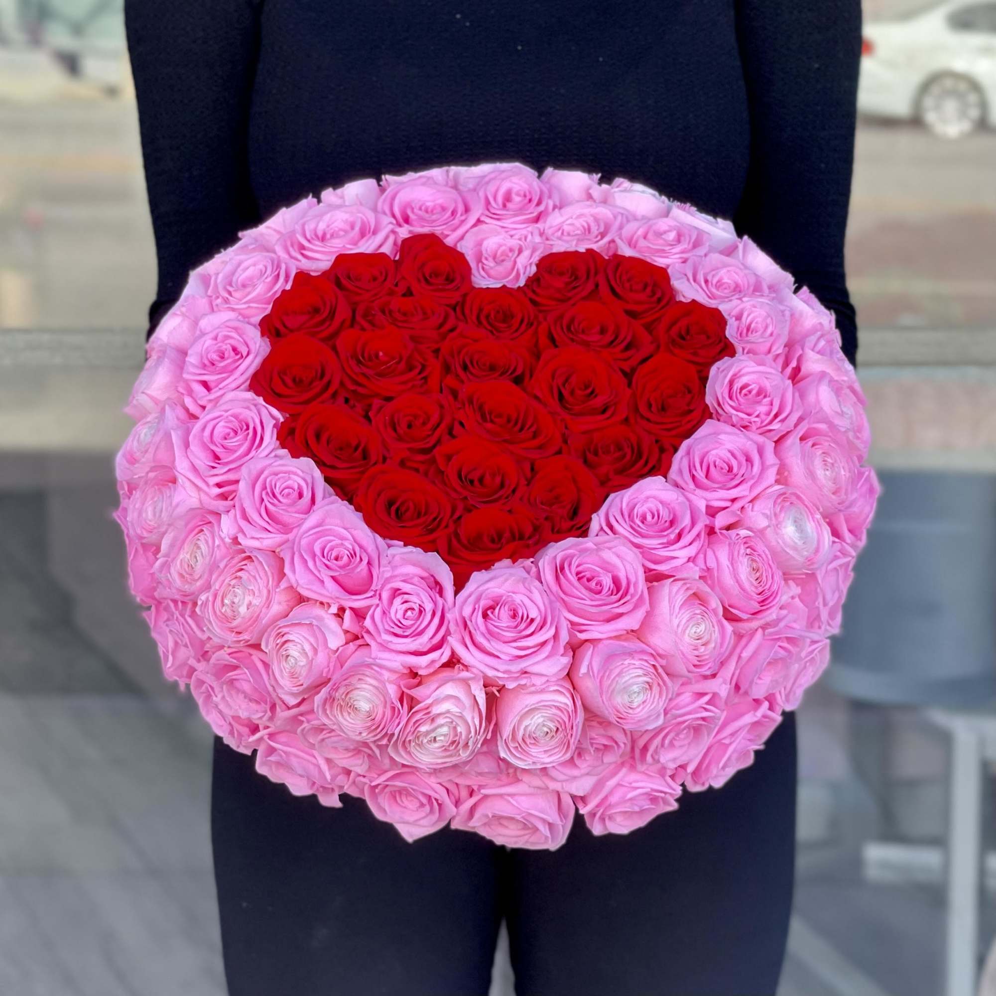 Red and Pink preserved roses in a vase