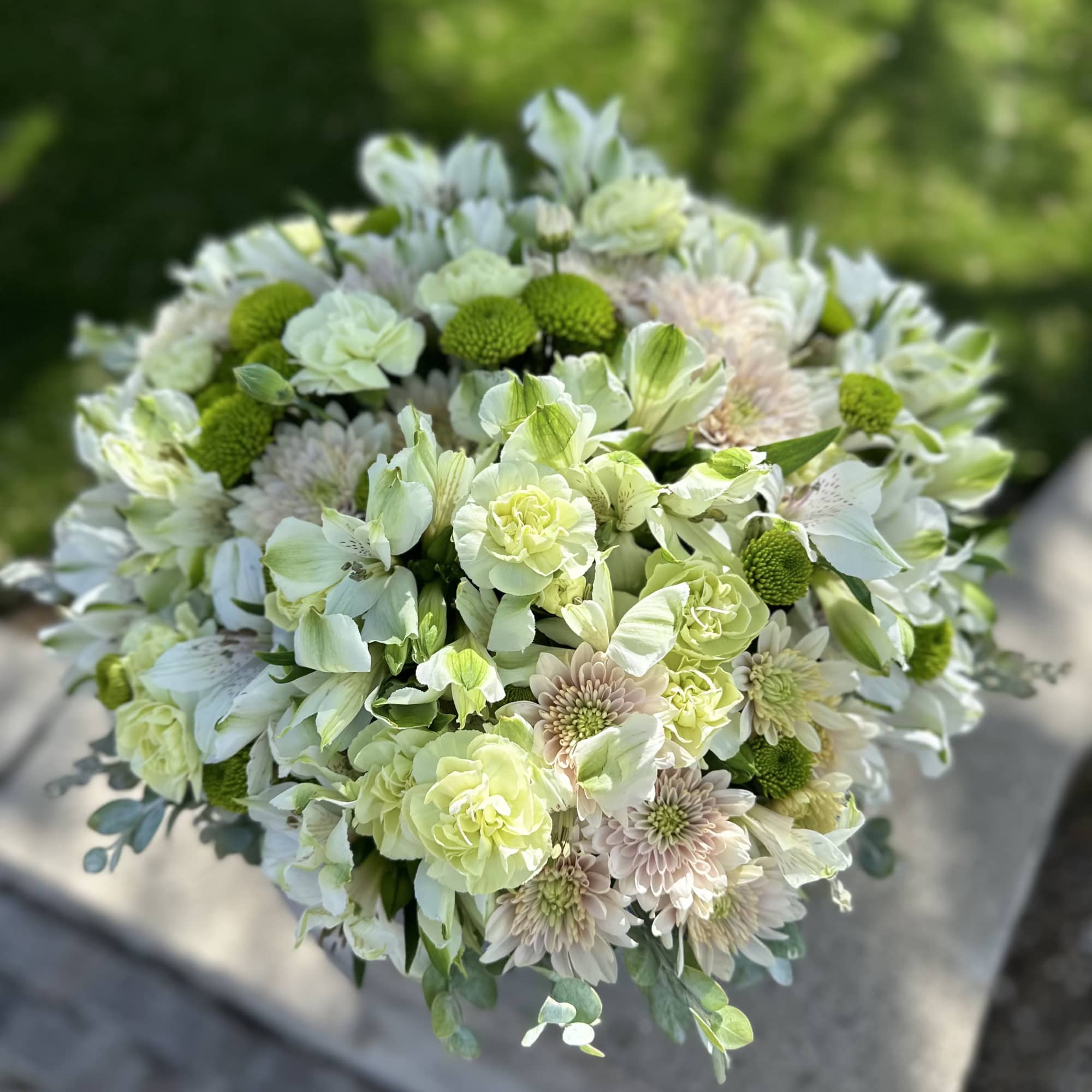 A fresh and elegant floral arrangement in a soft blue box. Featuring