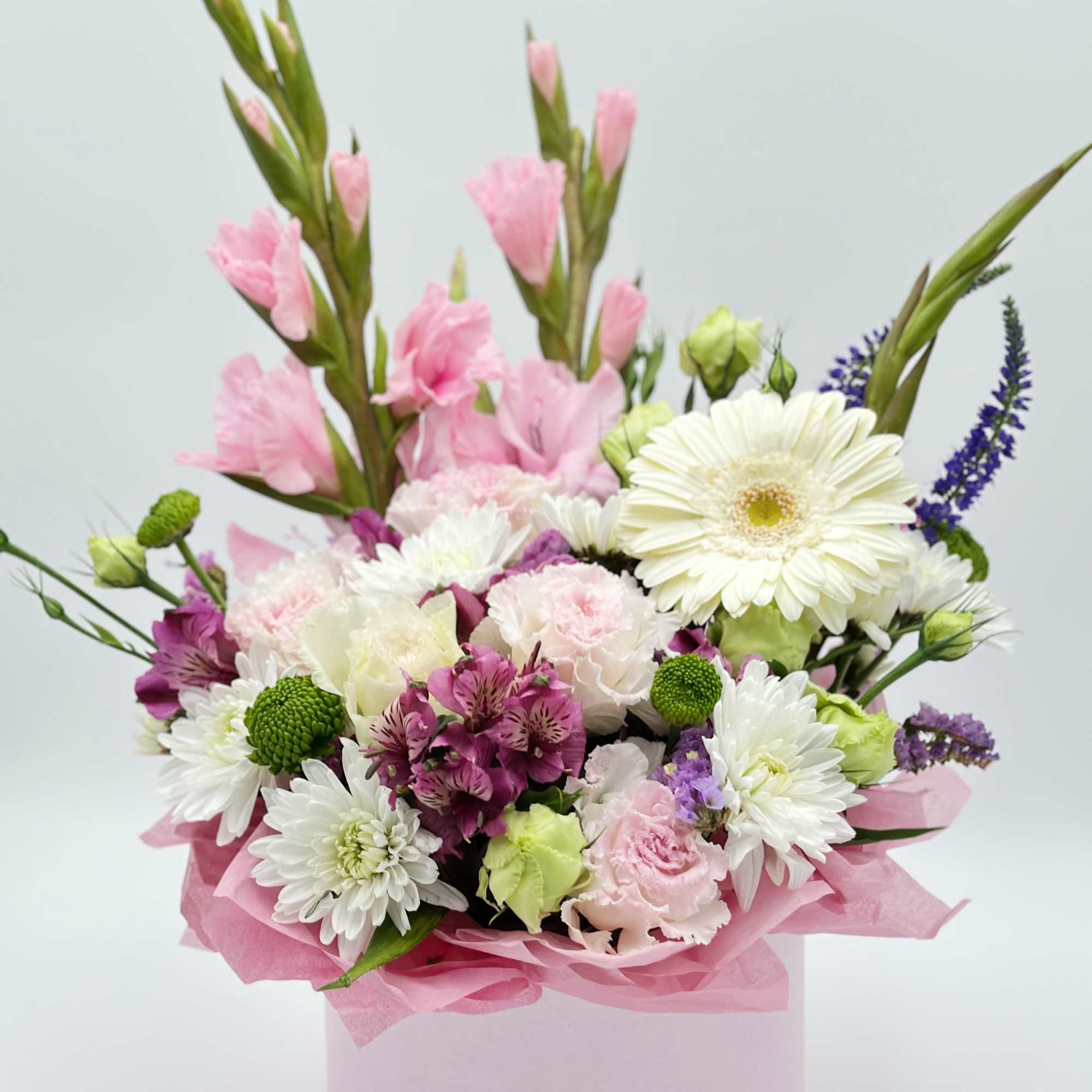 A bright and lively floral composition with elegant gladiolus taking center stage.