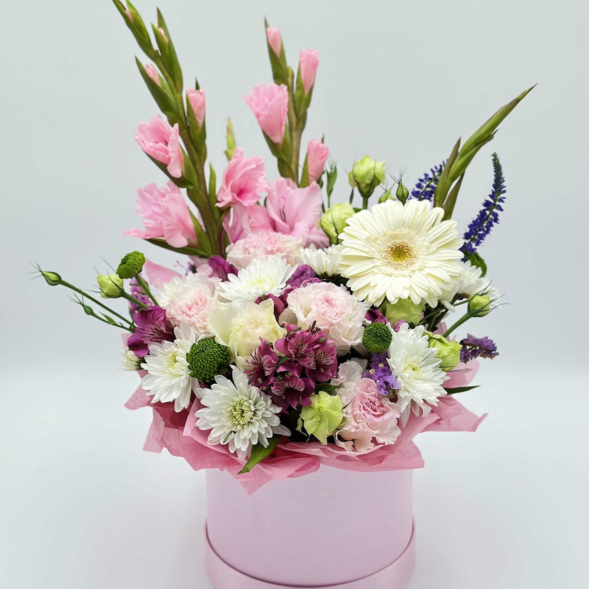 A bright and lively floral composition with elegant gladiolus taking center stage.