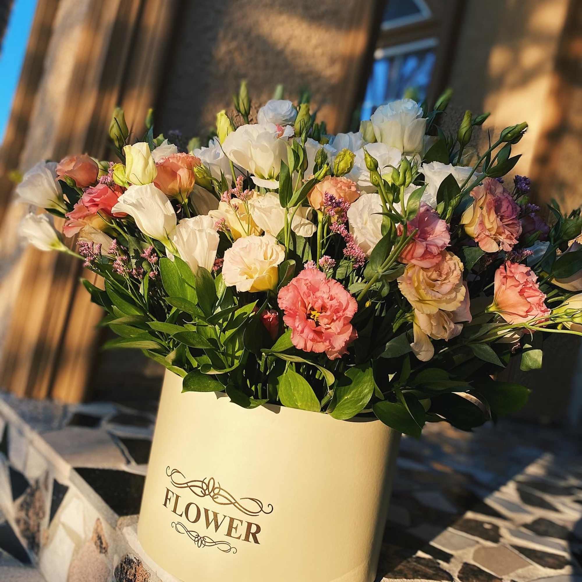 An airy arrangement of delicate lisianthus in a box - like a