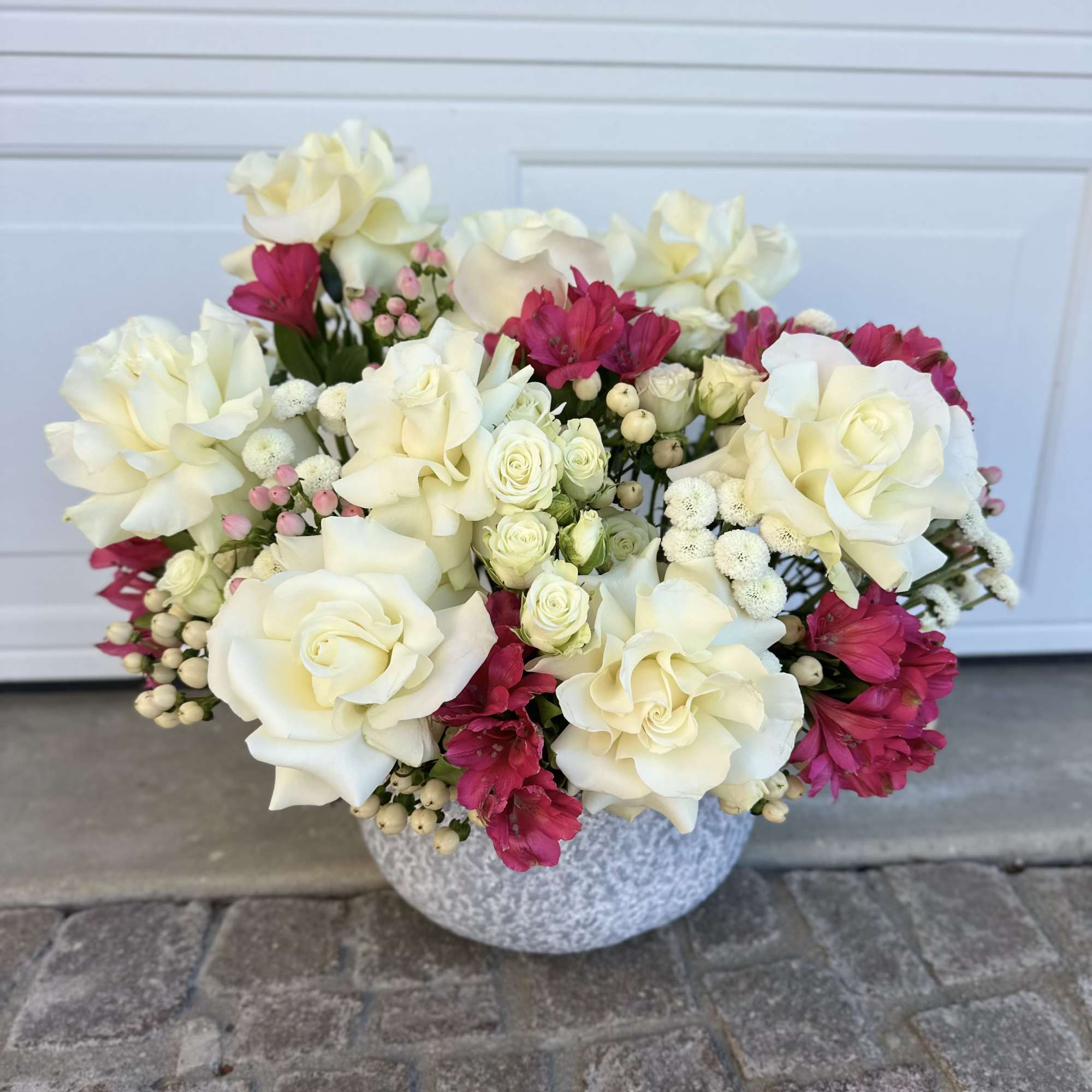 An elegant floral composition in a stylish ceramic vase &mdash; the embodiment