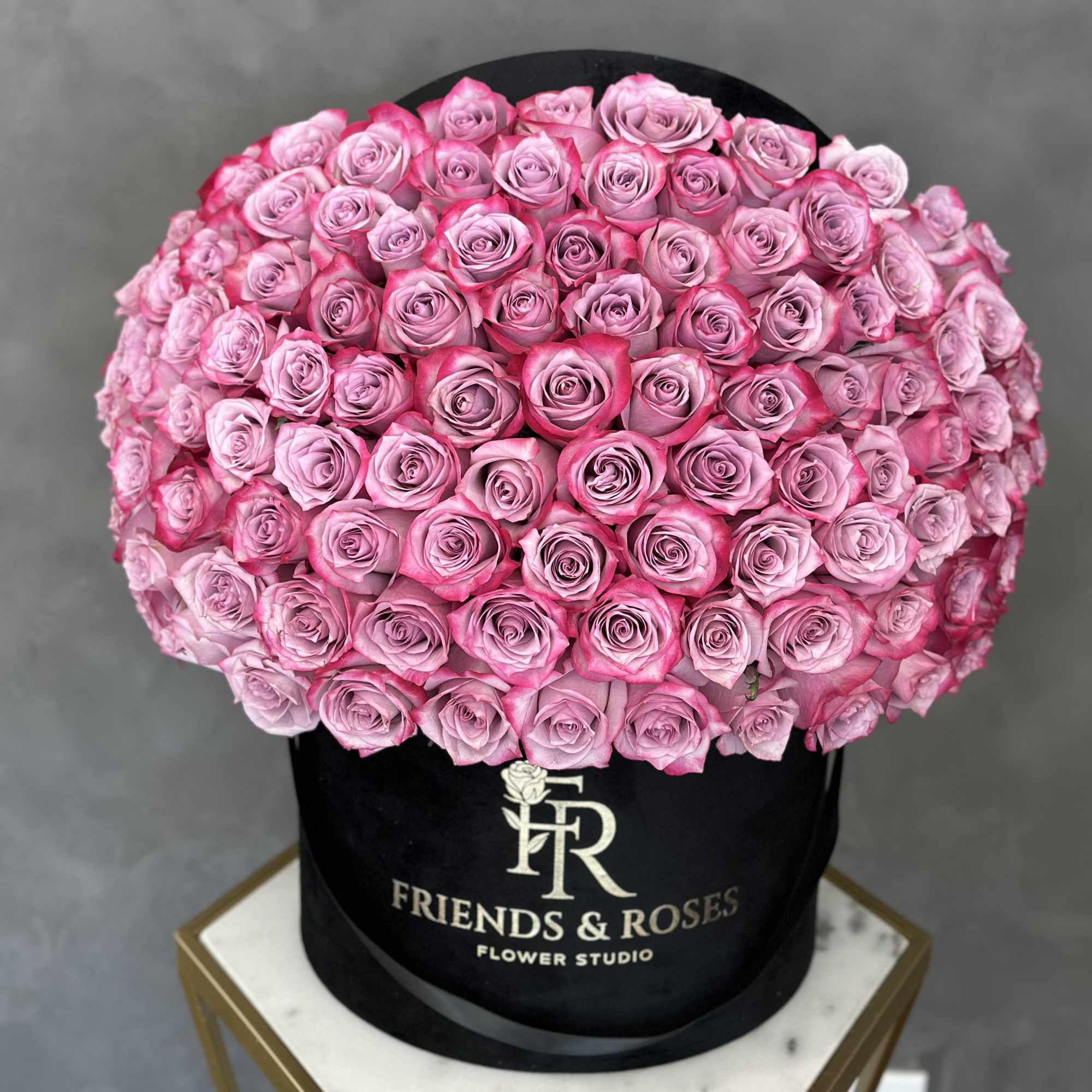 introducing our velvet black box filled with 150 purple roses a luxurious