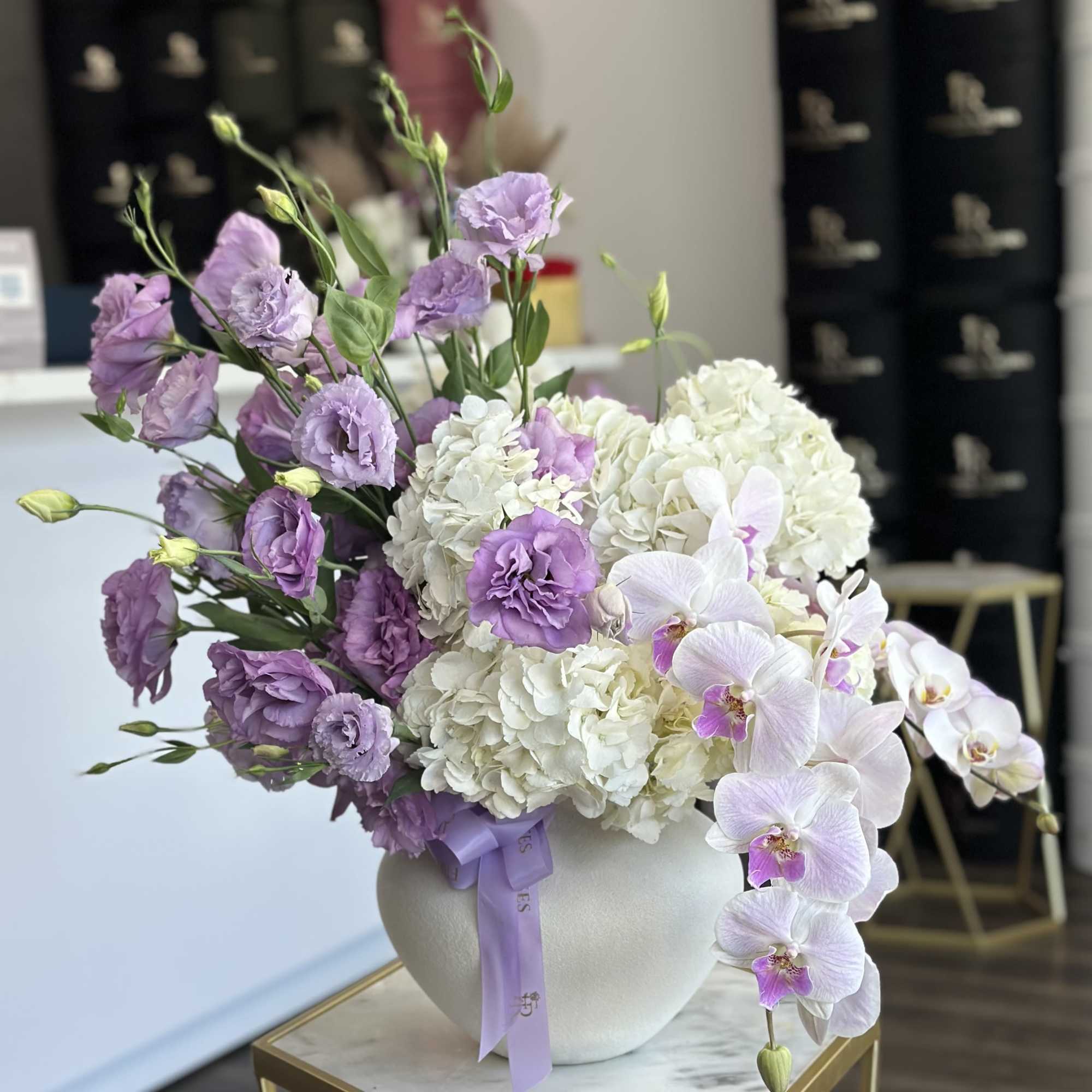 A creative designer composition in a modern vase, featuring delicate white and