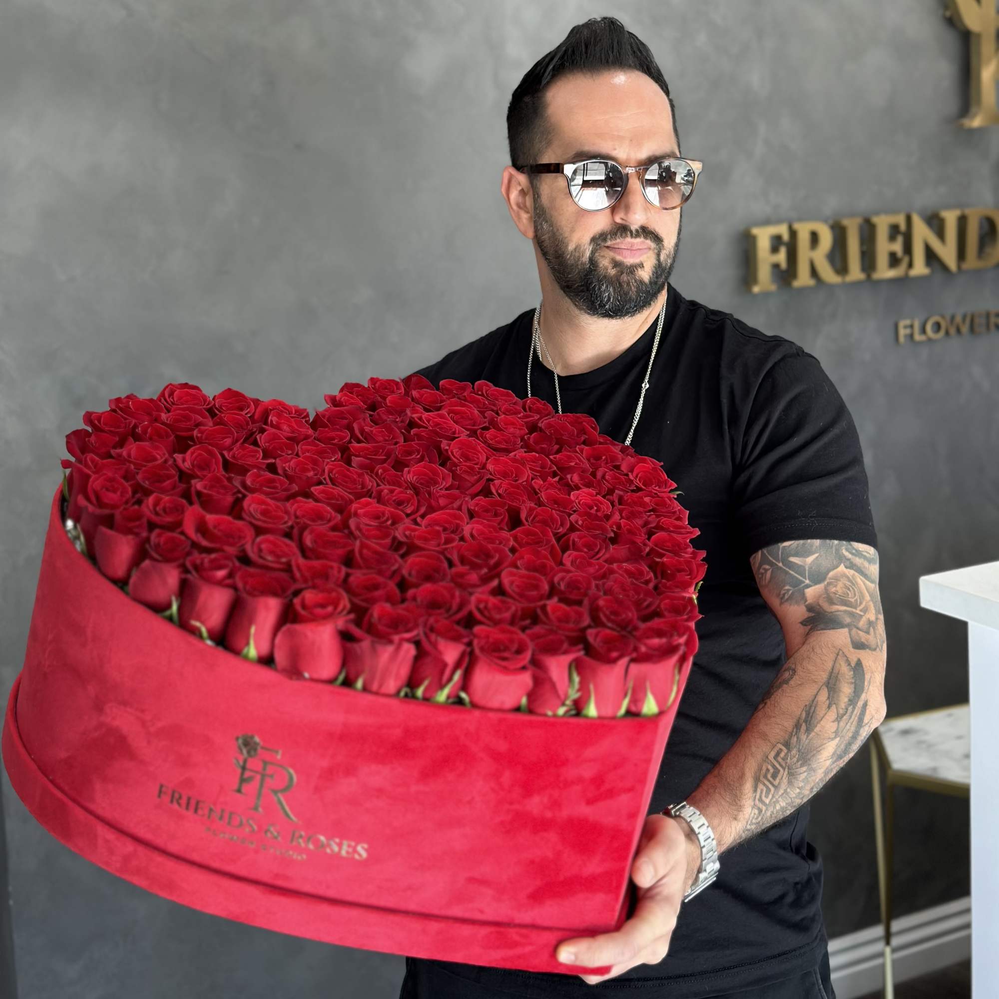 Our heart-shaped box arrangement with 125 fresh roses is a work of
