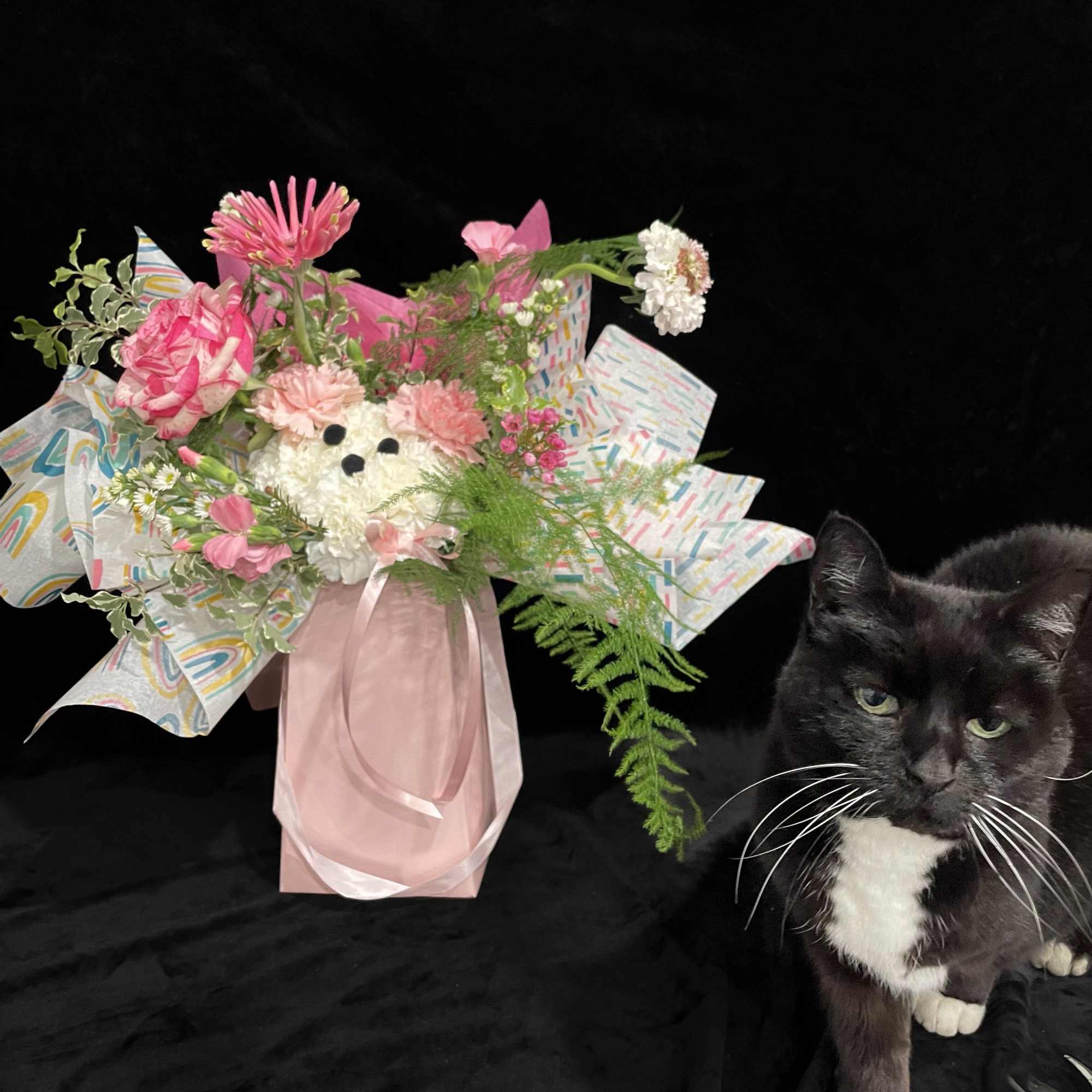 Our Petal Pup arrangement features an adorable little puppy crafted from soft