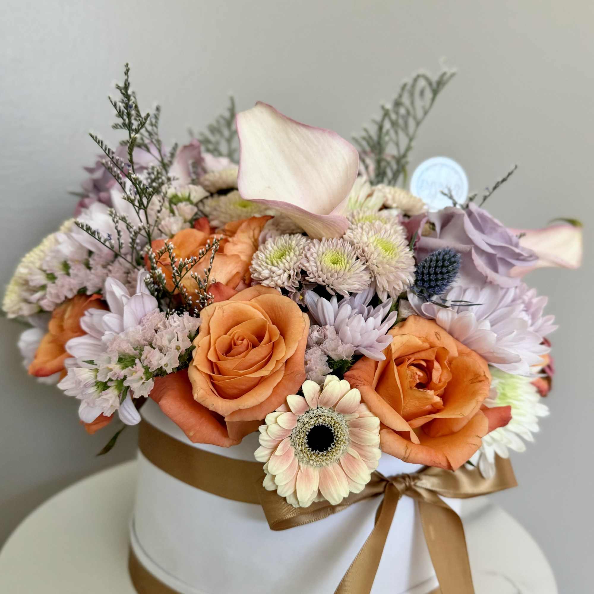 A beautiful mix of colors and flowers specially selected by the Florist.
