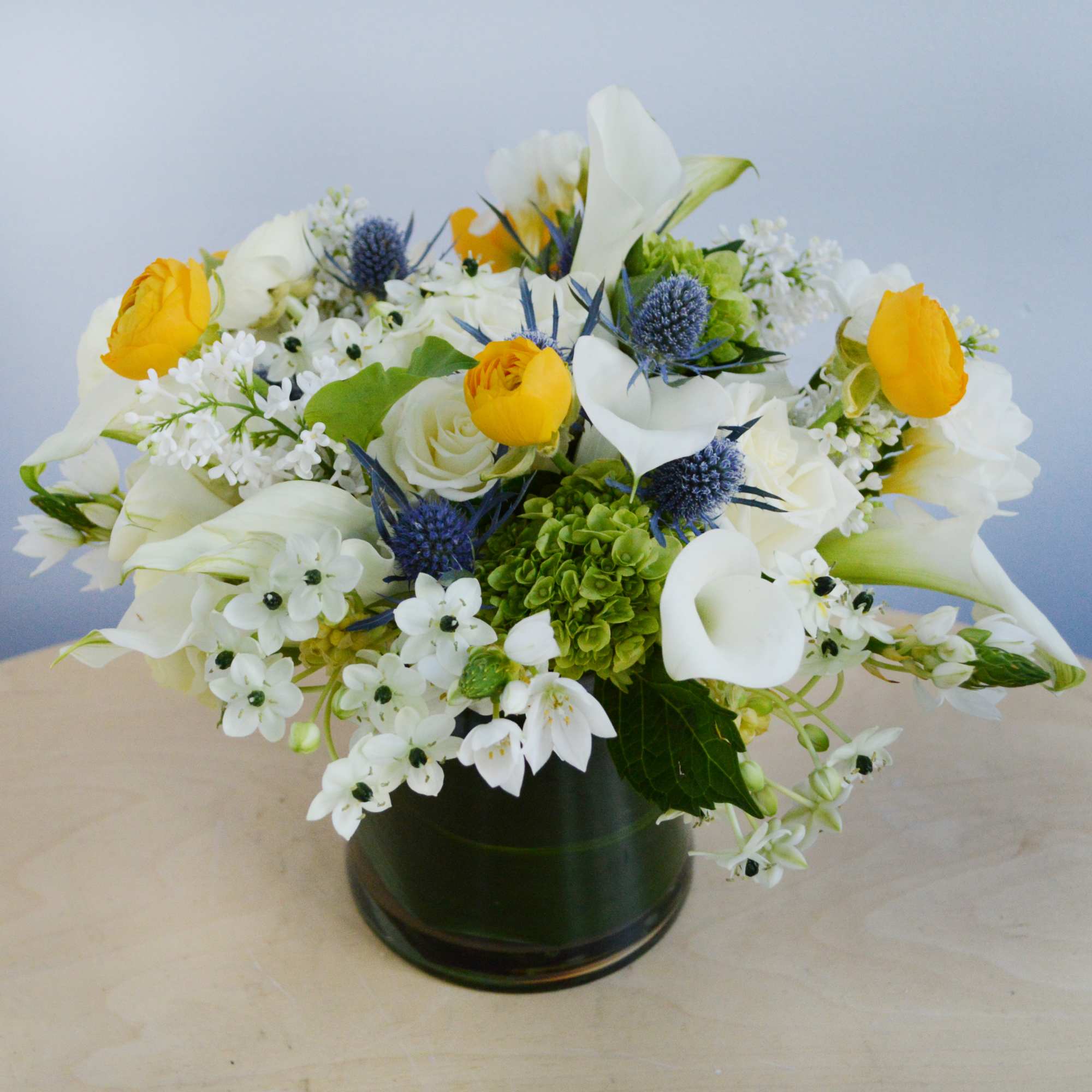 This whimsical vase arrangement features white Ornithogalum (or starflower), which is a