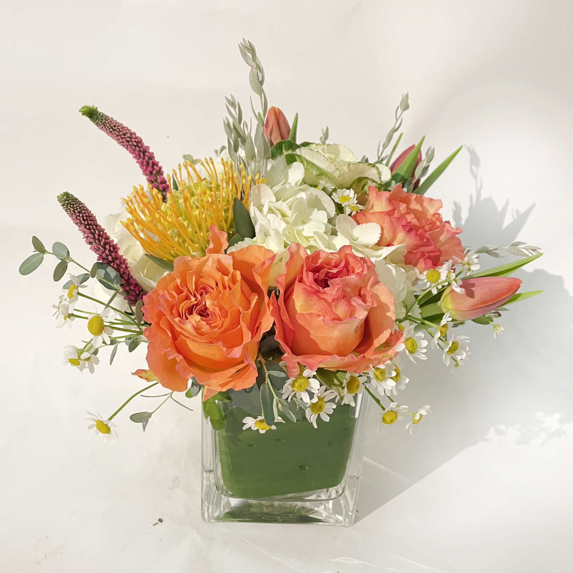 Lightly fragrant Free Spirit Garden Roses are the featured flower in this