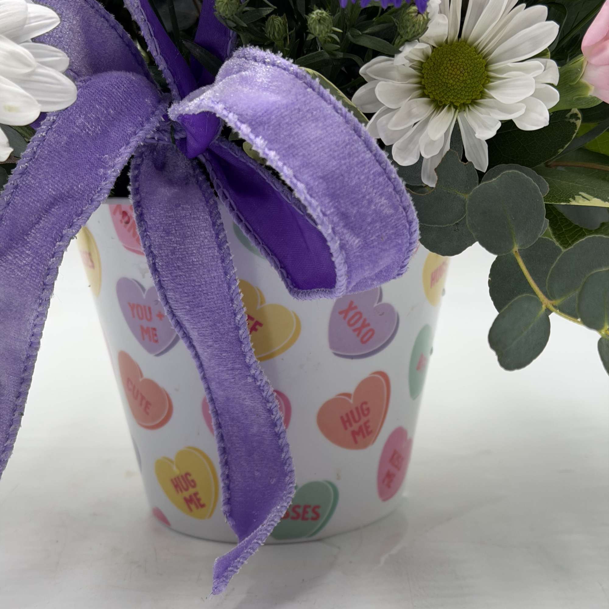 Celebrate love with soft blush roses, sweet pink carnations, white daisies and