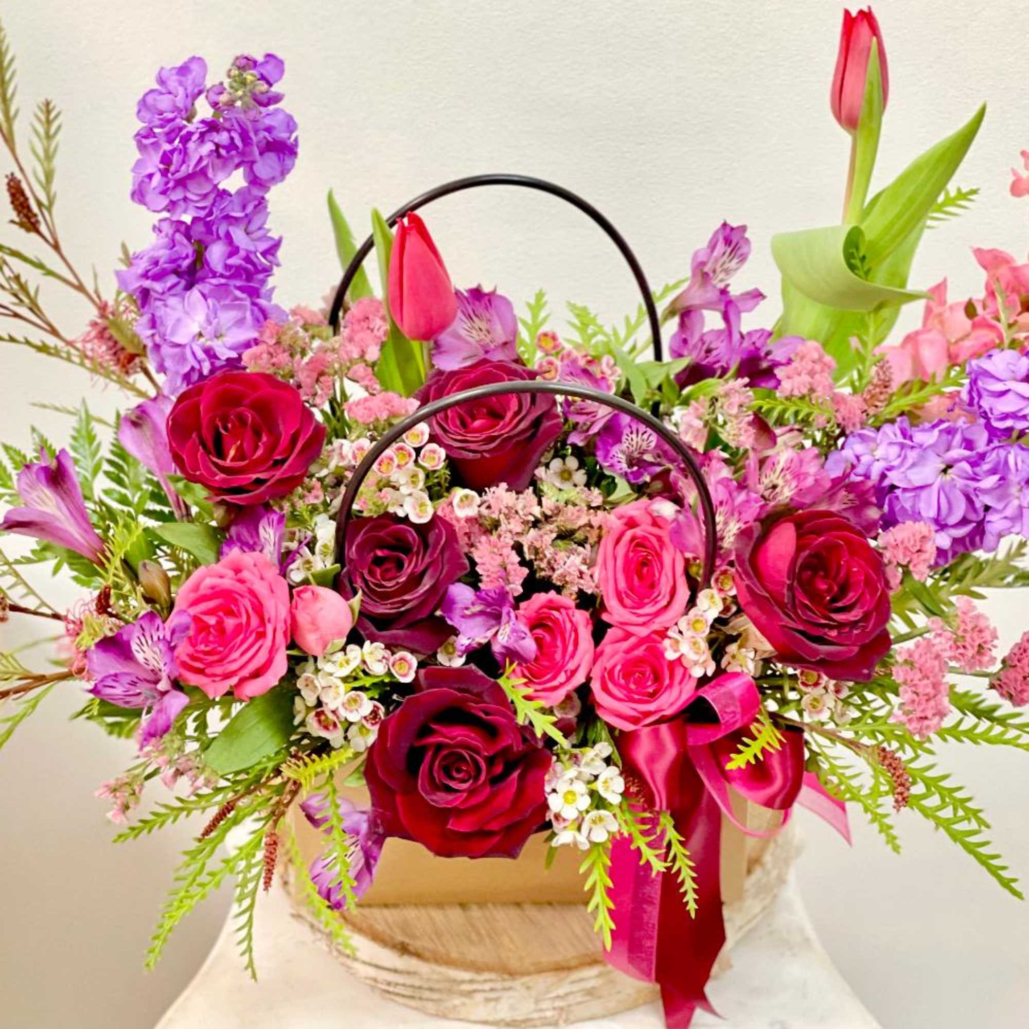 Product Information
Theme Colors: Shades of red, purple, and pink

Featured Blooms: Roses, spay