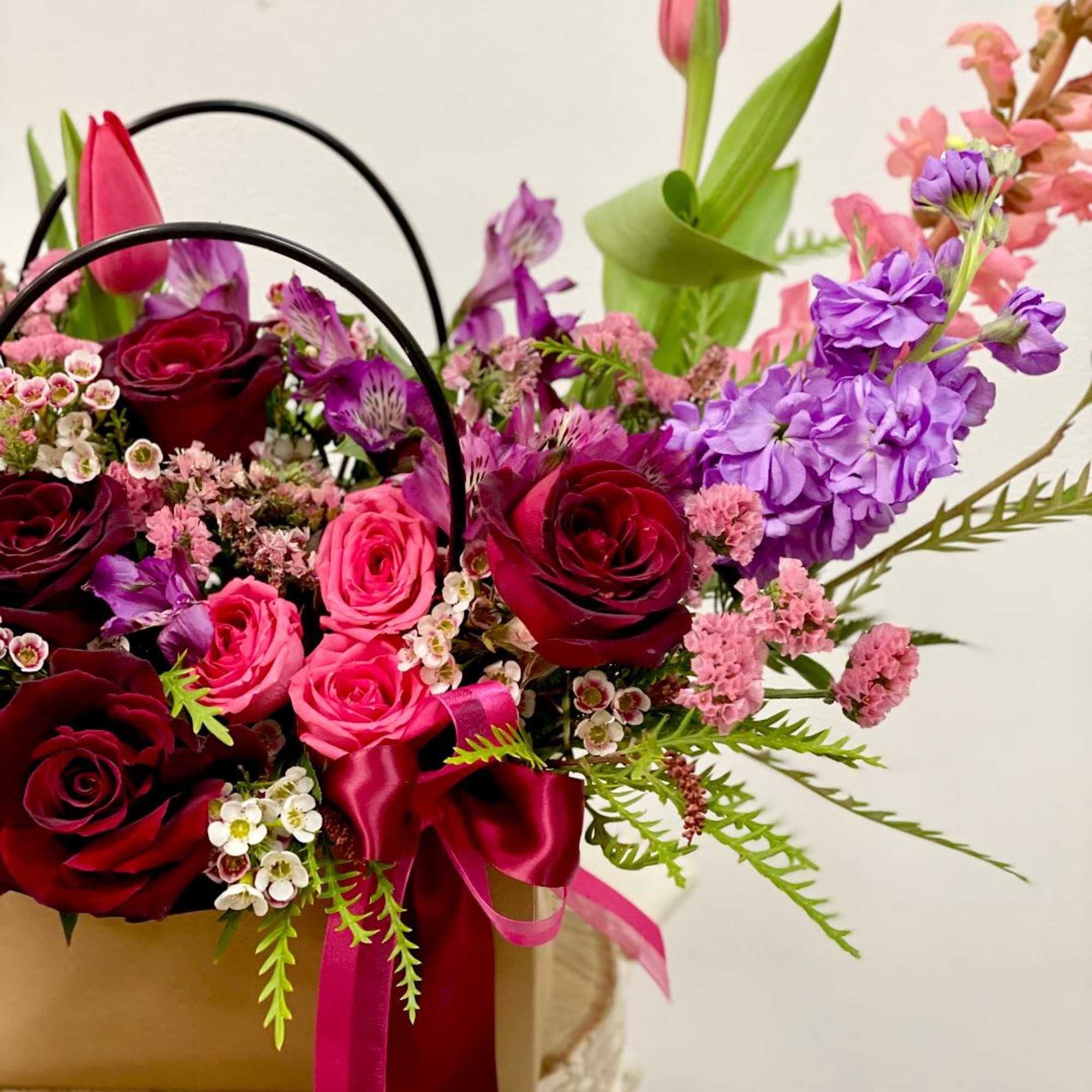 Product Information
Theme Colors: Shades of red, purple, and pink

Featured Blooms: Roses, spay