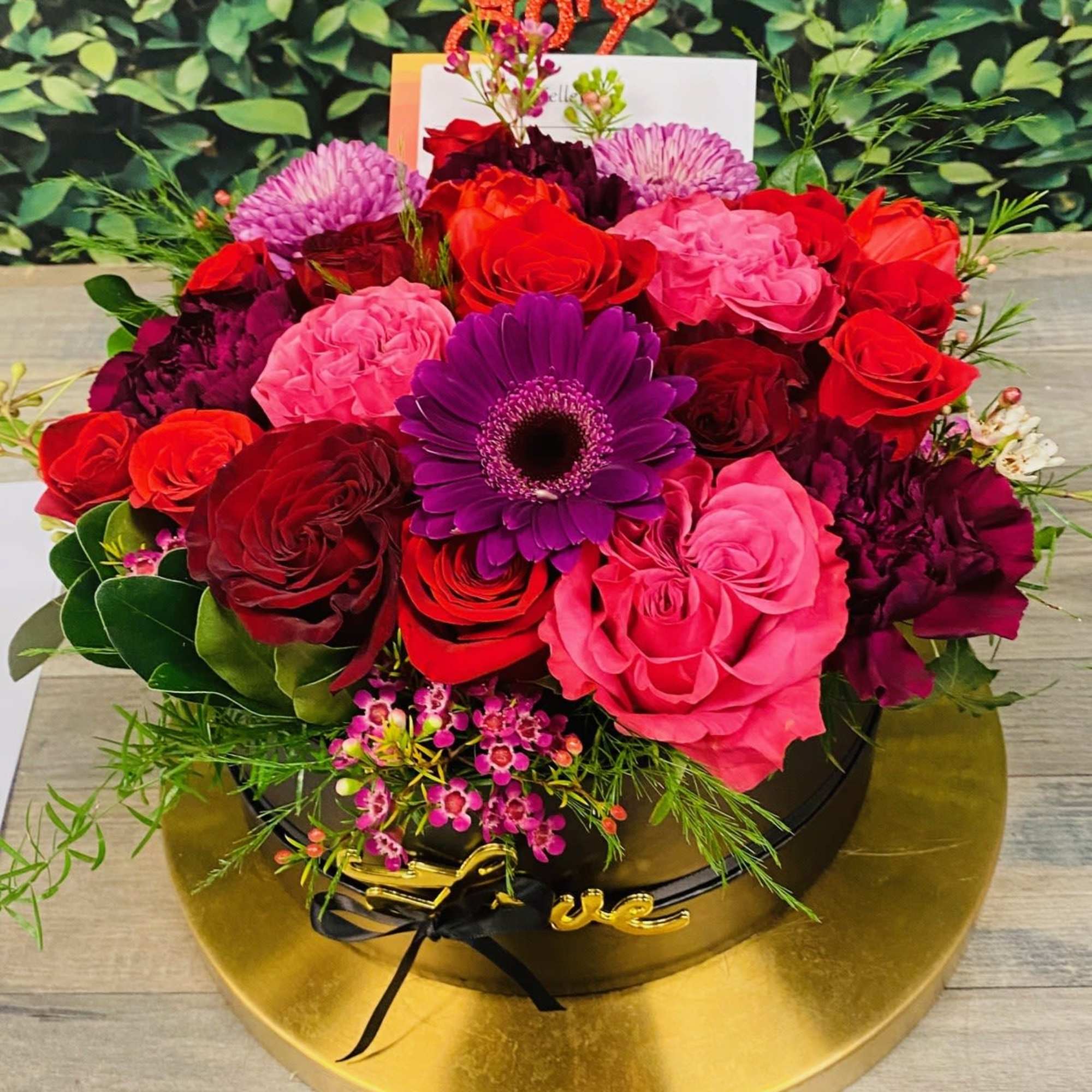 Bloomisical Box is composed of elegant roses and filler flowers, making a