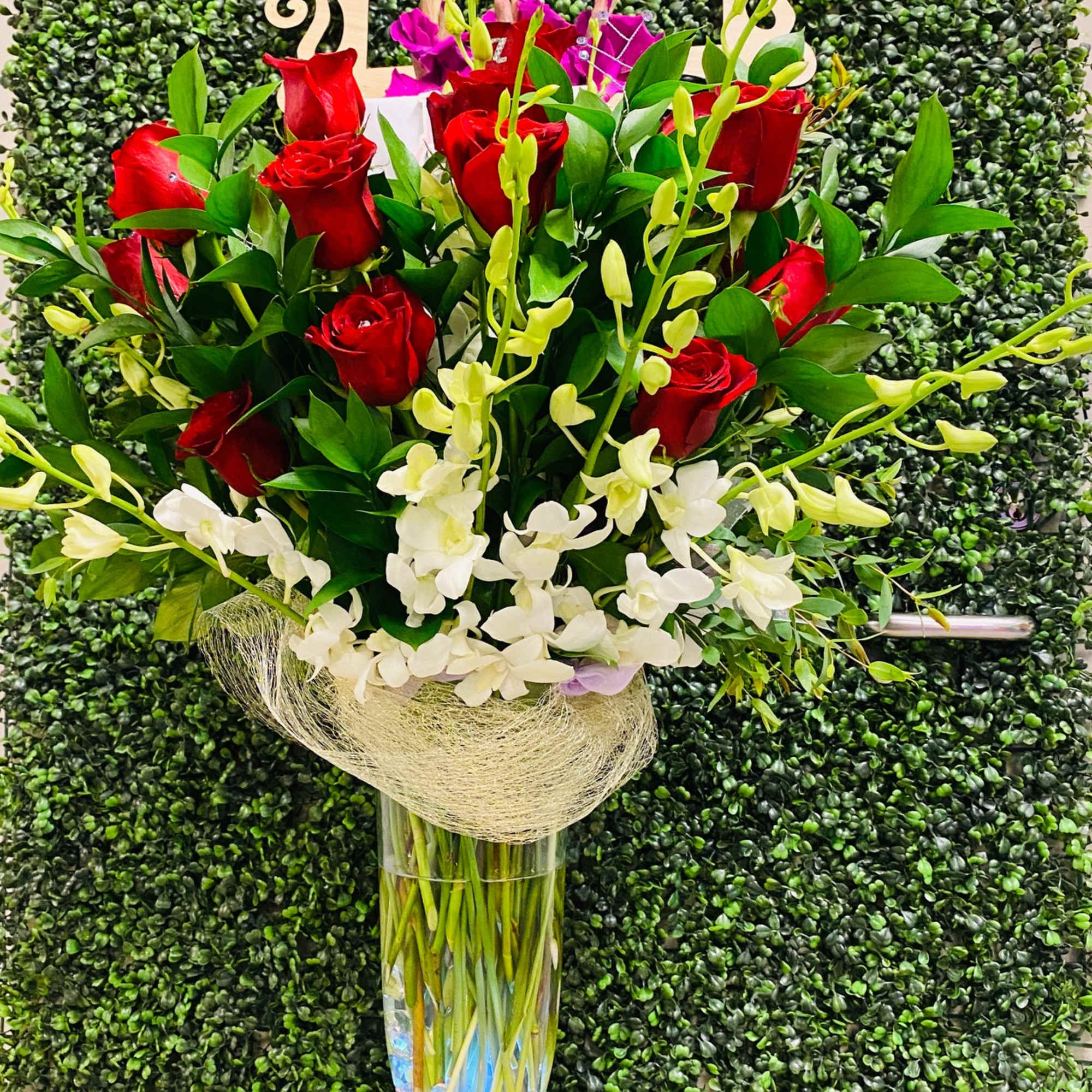 Grand and Gorgeous! Designed with fresh roses, orchids, luxe greens and upgraded