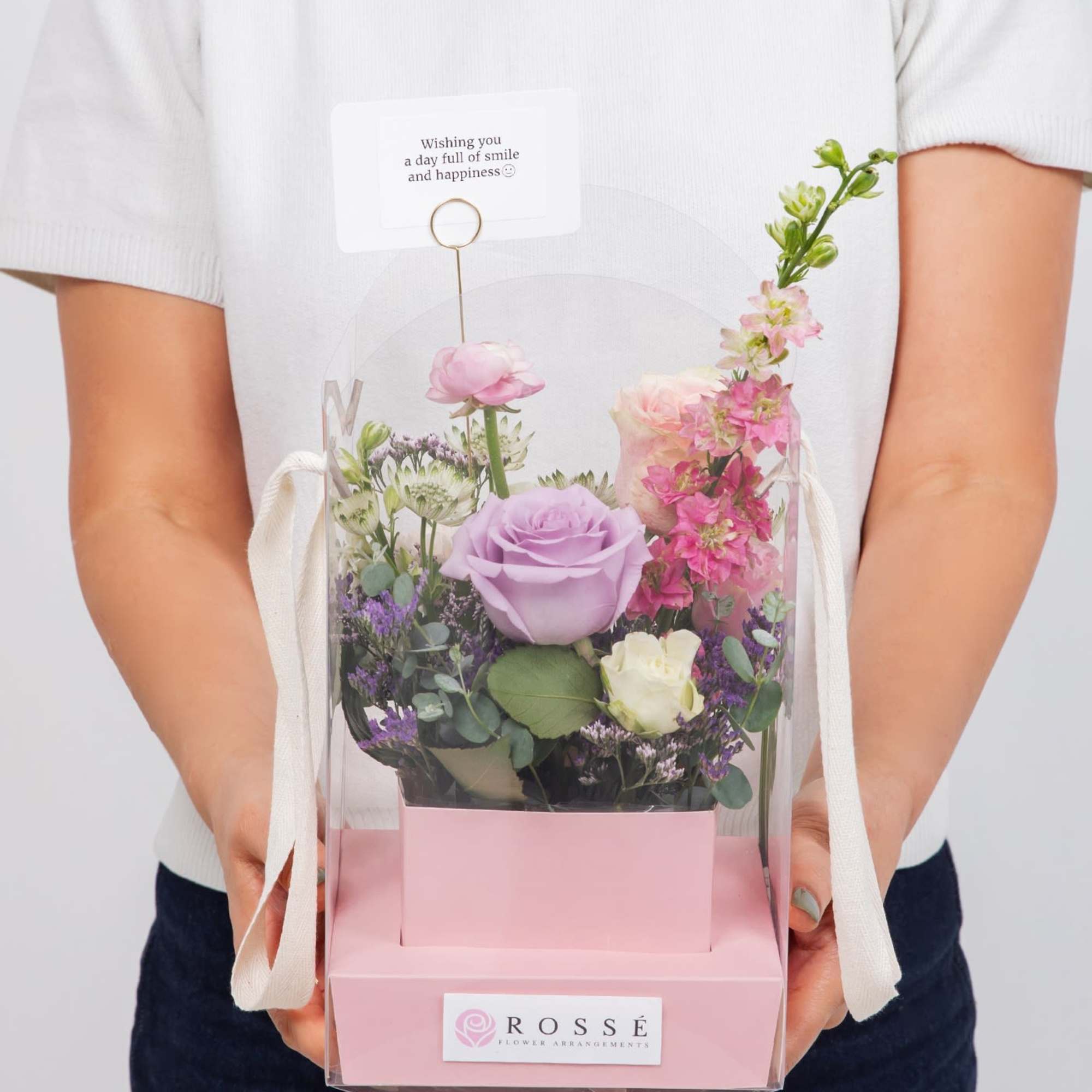 A Flowers bag featuring a soft pastel-colored box paired with an arched